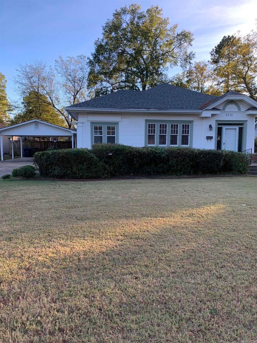 LBX. Lovely, bright & sunny older home near CBC & UCA. 3 good sized bedrooms, 2 updated bathrooms with glass showers, office with ceramic tile floor & exterior entrance, formal dining room, updated kitchen w/island, breakfast nook, great hardwood flooring. Refrigerator, washer & dryer stays. Very large living room with shiny hardwood flooring. Huge, fenced, shady back yard with pavilion/picnic area, raised flower beds/garden, two story storage building/playhouse for the kids. Central heat & air has service contract. Front porch has iron fencing with gates. Covered back porch. Covered 2 car Carport. All sitting on .37 acre. Owner has moved & selling as-is, willing to look at any and all offers.