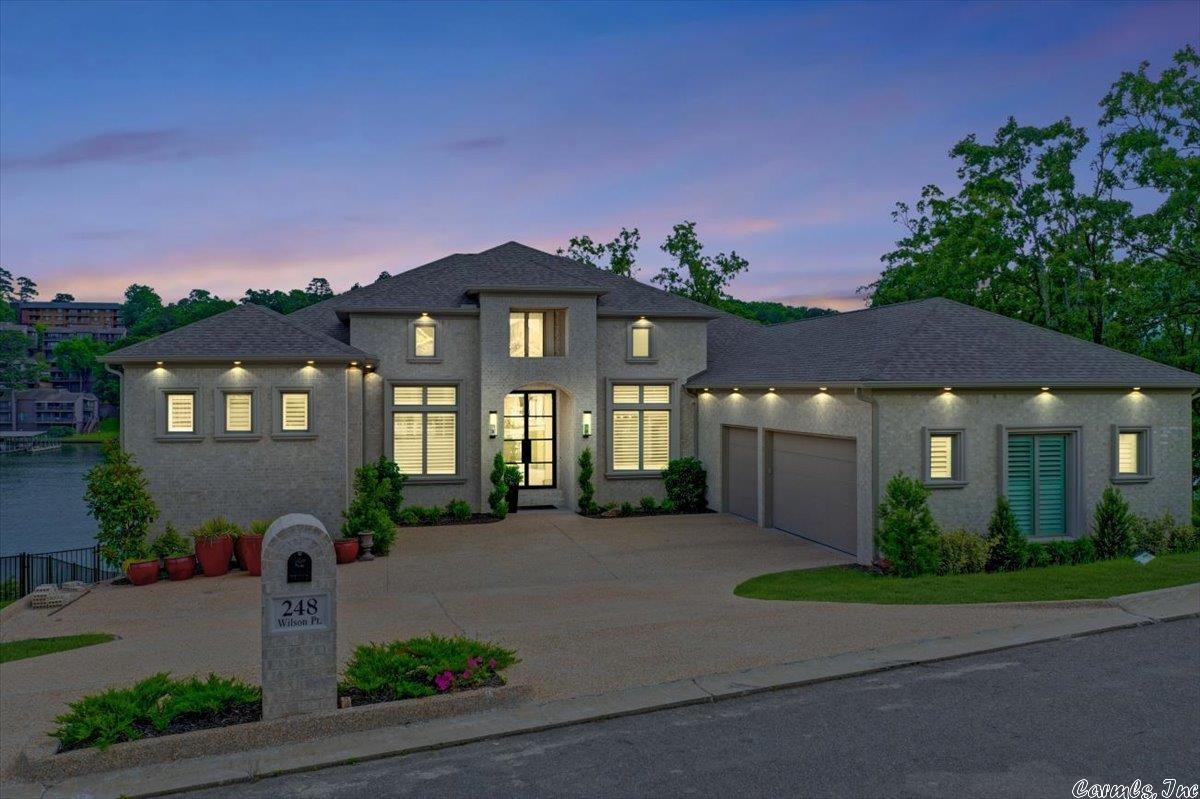 No updating needed here! This Lake Hamilton beauty offers gorgeous views and located in the prestigious 7 South area. Amenities in the primary suite include coffee bar, fireplace in primary bath, free standing tub, gigantic walk around shower, two large closets with dressing area. Chef's kitchen with all upgrade appliances, huge pantry with built-in cabinet for small appliances, wet bar, butler's pantry, and outdoor kitchen. Perfect home for entertaining and Lake Living! Permitted for 2 stall boat dock.