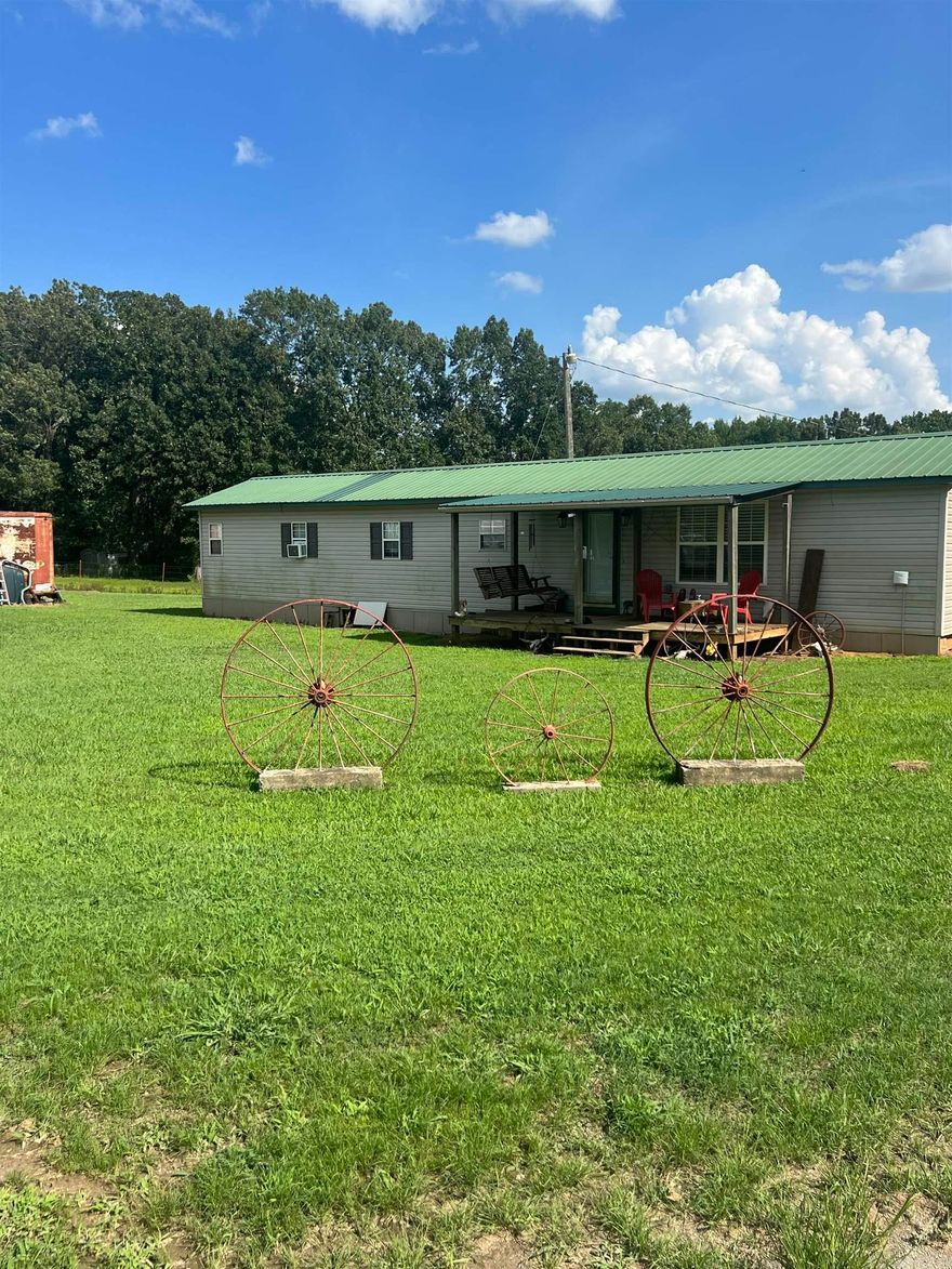 If you want the country life you have found it. Great place to run cattle, hunt, or build your dream home. This estate offers a cozy home that's been completely updated. Relax on the front porch or work on a project in the shop. The shop and the home sit on the hill barely visible from the road. Bayou Meto runs through the back slither piece of land offering you a nice water feature. Call today for your own personal showing.