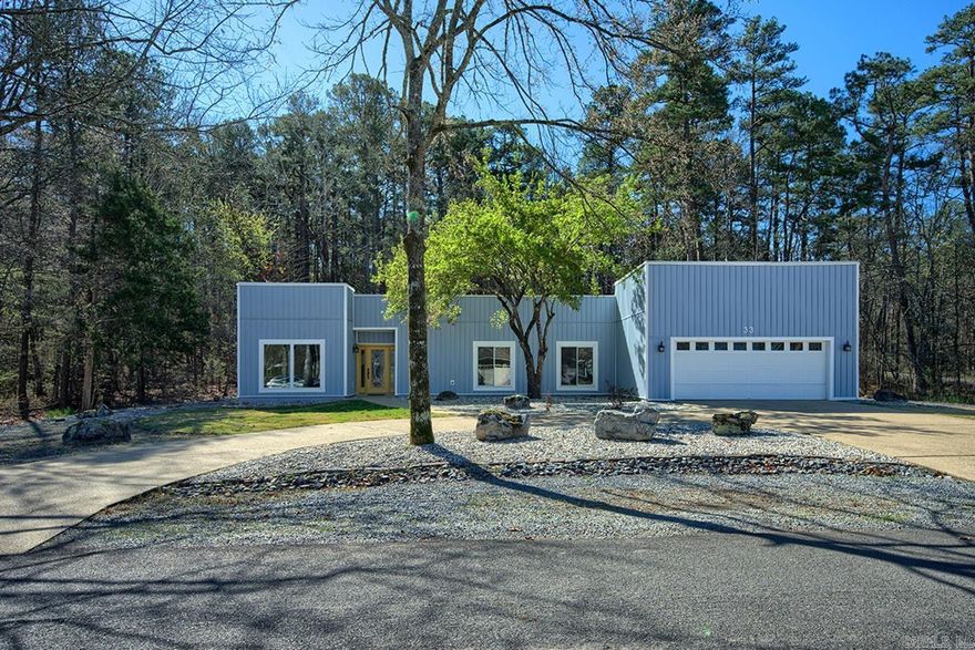 Striking contemporary home with subtle Southwest influence and a relaxed lakeview vibe. This beautifully updated 3 bedroom, 2 bath residence features clean architectural lines, warm natural textures, and expansive new windows that fill the home with natural light. A dramatic gallery hallway space highlighted by three skylights adds architectural interest and creates a bright, airy transition through the living areas. The open living space offers soaring ceilings and an inviting atmosphere that blends seamlessly with the surrounding natural setting and provides year round views of Balboa Lake across the street. A stunning new kitchen showcases modern finishes, updated cabinetry, and generous workspace, creating the perfect gathering place for entertaining and everyday living. Spacious bedrooms provide comfort and privacy, while the primary suite offers a serene retreat. With over $200,000 in recent upgrades—including a new roof, new windows, and a completely renovated kitchen—this home offers both contemporary style and exceptional value. Outdoor living areas invite you to relax and enjoy the peaceful setting that surrounds this distinctive property.