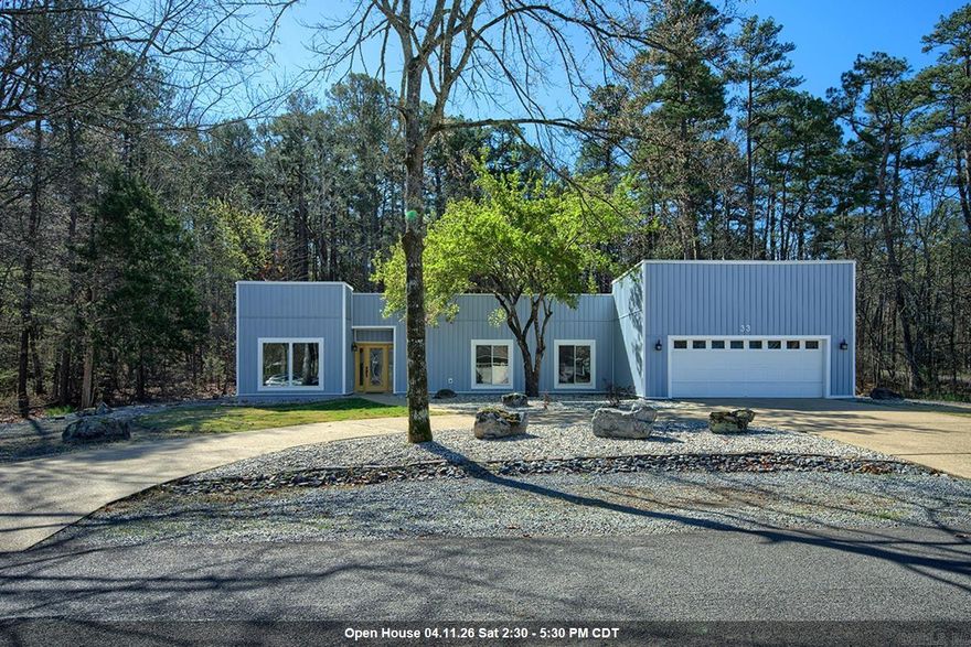 Striking contemporary home with subtle Southwest influence and a relaxed lake view. Ample parking with a circular drive. This beautifully updated 3 bedroom, 2 bath residence features clean architectural lines, warm natural textures, and expansive new windows that fill the home with natural light. A dramatic gallery hallway space highlighted by three skylights adds architectural interest and creates a bright, airy transition through the living areas. The open living space offers soaring ceilings and an inviting atmosphere that blends seamlessly with the surrounding natural setting and provides year round views of Balboa Lake across the street. A stunning new kitchen showcases modern finishes, updated cabinetry, and generous workspace, creating the perfect gathering place for entertaining and everyday living. Spacious bedrooms provide comfort and privacy, while the primary suite offers a serene retreat. With over $200,000 in recent upgrades—including a new roof, new windows, and a completely renovated kitchen—this home offers both contemporary style and exceptional value. Outdoor living areas invite you to relax and enjoy the peaceful setting that surrounds this distinctive property.