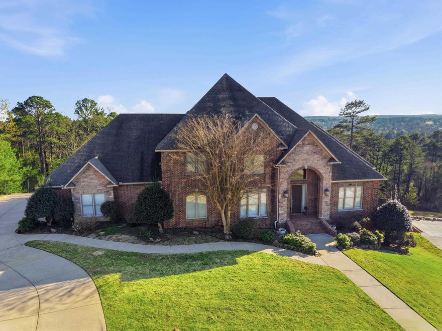 Desirable LaMarche home on nearly one acre! Elegant entry opens to a large office with natural light and a formal dining room. The great room features a gas-log fireplace and wet bar, open to the chef’s kitchen with stainless 5-burner cooktop, double ovens, microwave, and granite countertops. The breakfast bar connects to the hearth room with a second fireplace and casual dining area. Main-level primary suite with double vanities, tub, shower, and large walk-in closet. Also on the main level: guest bedroom with bath and walk-in closet, plus a spacious laundry room. Upstairs offers a large game room, three bedrooms, and two full baths. Enjoy outdoor living on two decks overlooking a privacy-fenced yard with sprinkler system. Three-car garage and abundant storage throughout plus two underhouse storage areas. This home is perfectly designed for comfortable family living and ready for your finishing touches! Agents see confidential remarks.