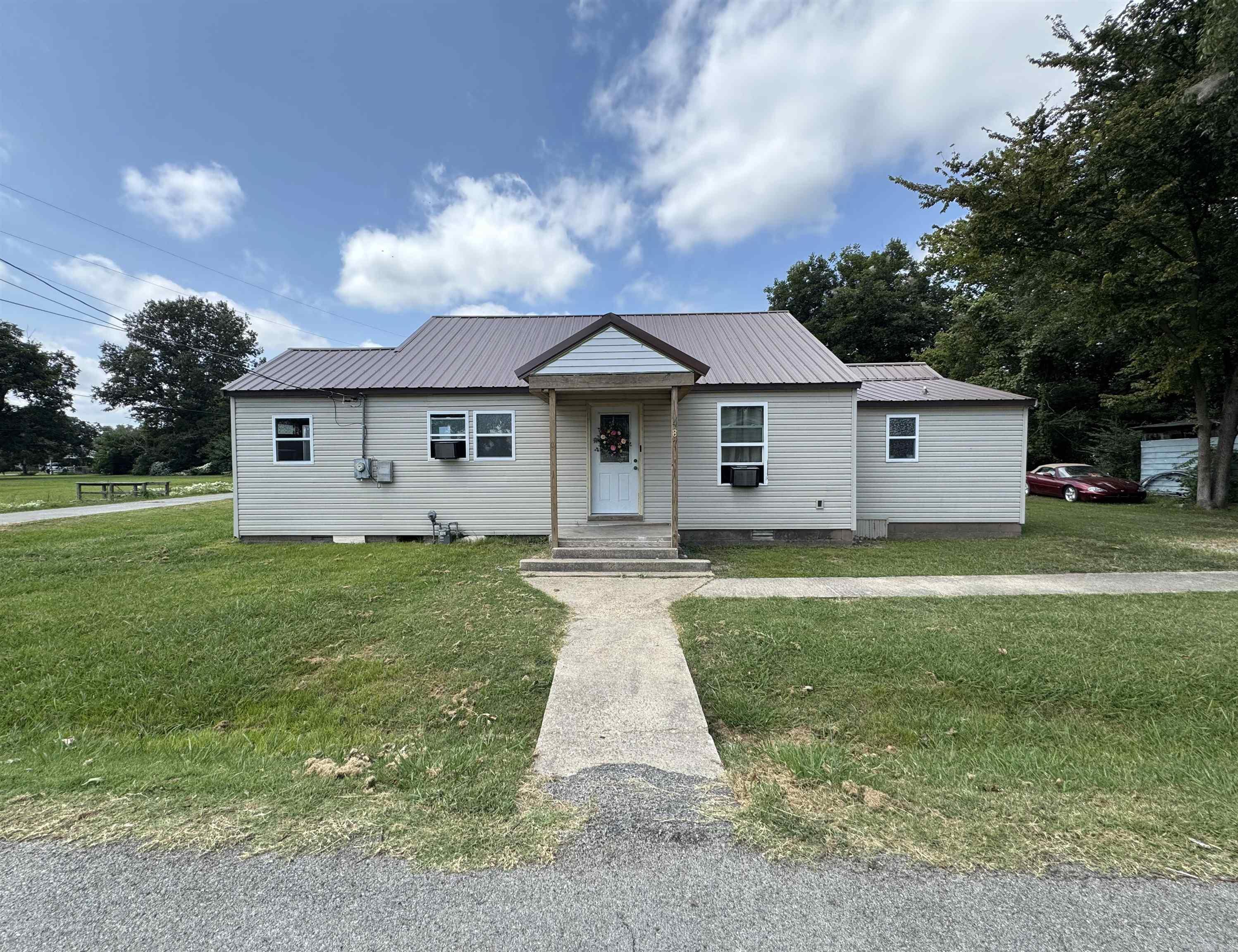 487 S. Garfield Ave. Piggott, AR 72454 is a 3 Bedroom, 2 Bathroom, 1,080 SQFT- Unfinished home sitting on a .20 Acre lot. This home has new exterior features such as vinyl siding, insulated widows, and a metal roof. All of the supplies to finish the interior are included in the purchase price, or the price is negotiable without the supplies. This would make a perfect starter home, fixer-upper, or investment property.