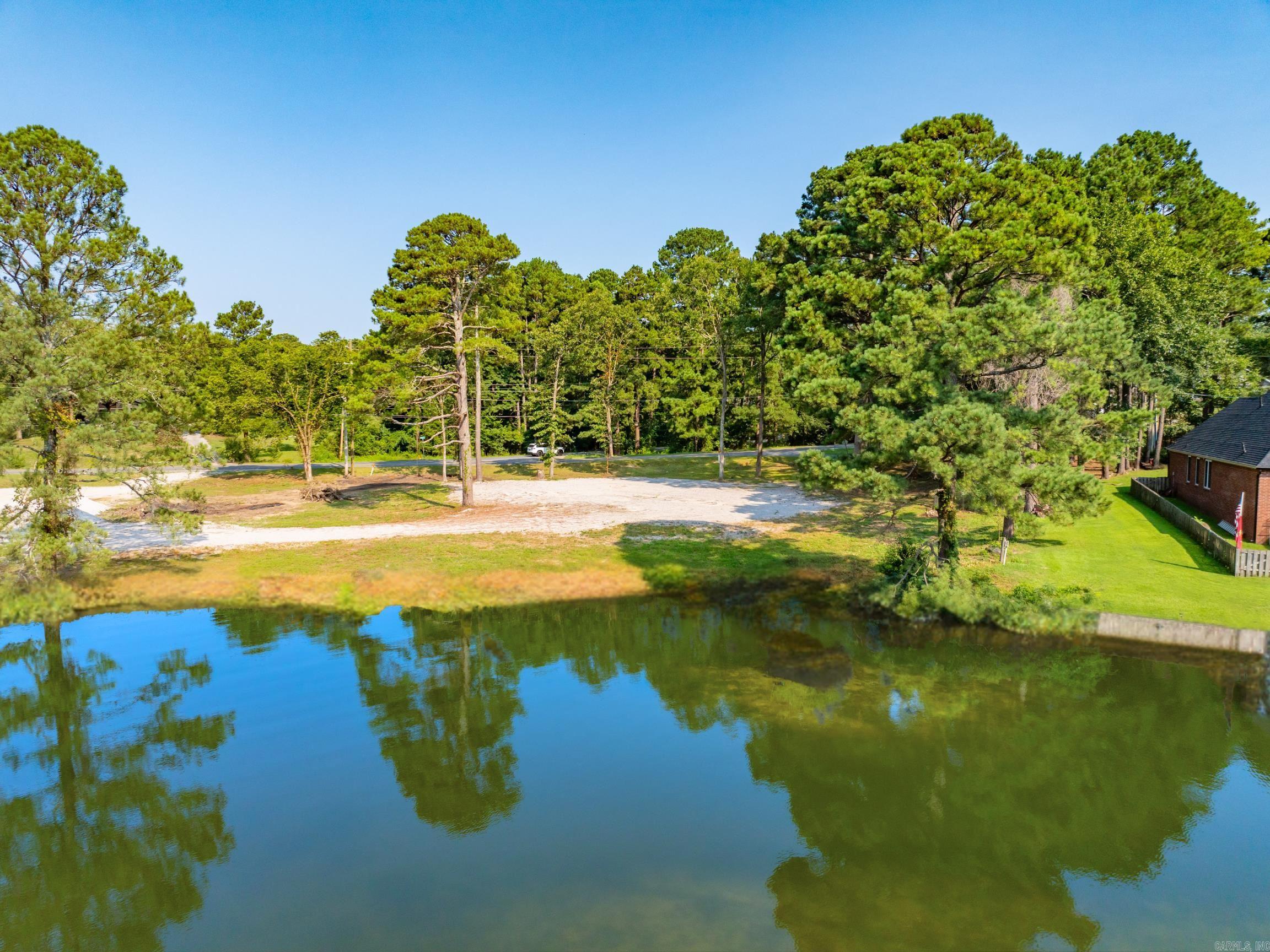 Build your dream home or your lake front retreat on this Lake Hamilton property in Lake Hamilton School District. This expansive lot offers the ideal setting to design and build your custom luxury home in a highly desired area. Utilities at road. No HOA. This property is a blank canvas with endless possibilities for your dream lifestyle. Don't miss this incredible opportunity to own a piece of paradise!