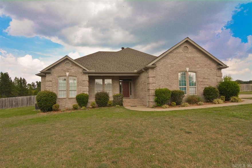 Approx 425 Sq Ft separate "in law quarters" included in total square footage., approx 2047 Sq ft in main house. Walk into main house thru foyer and are WOWED by the wall of windows with ceiling crown molding and deep crown headers over doors and windows. Kitchen with granite and stainless appliances.. Windows look over the pergola covered extensive decking that leads to matching separate living quarters for elderly parents or children with special needs to live independently. Many other extras.