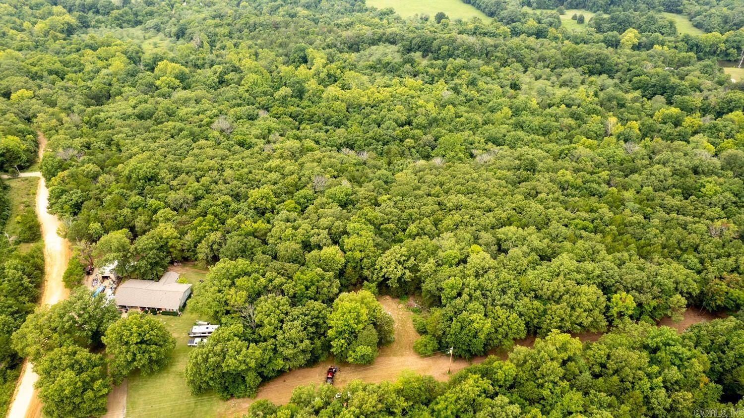 Creekfront Acreage for Sale in Hardy Arkansas! Escape to this peaceful 3.3-acre property, offering a perfect balance of privacy, natural beauty, and abundant wildlife. Enjoy the freedom to hunt, explore, and immerse yourself in the tranquil surroundings, as the land comes with no restrictions. A serene creek meanders through the back of the property, flowing toward the South Fork River - an ideal spot for fishing, floating, and swimming. Whether you're looking for a peaceful retreat or outdoor adventure, this property has it all. With existing utilities including septic, electricity, and a well, the property is ready for your dream home, cabin, or weekend getaway. Located just minutes from Cherokee Village Golf Course (near hole 18) and public access to the Spring River, this location offers both seclusion and convenience. Just 5-10 minutes from town, you'll enjoy the perfect blend of country living with easy access to local amenities. Don't miss this rare opportunity to own your own slice of paradise!
