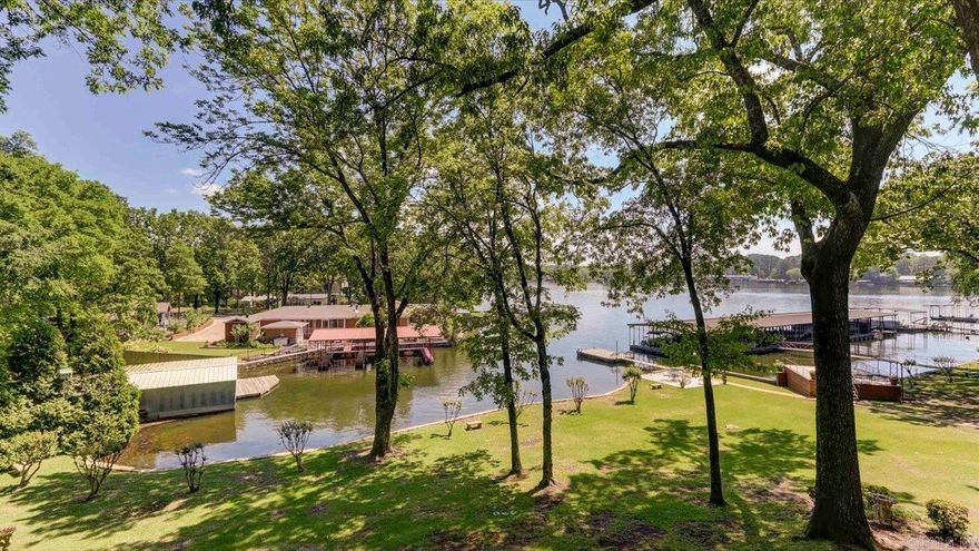 Lake Hamilton front Condo!! You simply can't afford to miss out on this amazing opportunity! With an updated 2BR/2BA condo situated in a prime central location, featuring a balcony with stunning lake and landscape views, this is the perfect place for you to relax and unwind. Real hardwood floors and upgraded baths. Move in Ready. Act now and make this condo yours!