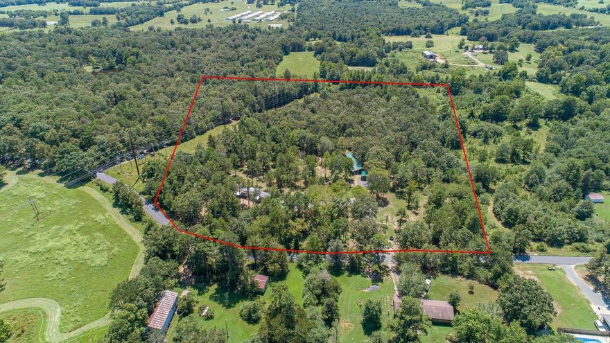 Located in one of the most popular tourist locations in southwest Arkansas, these two properties are income producing. There are two dwellings on this 10.6 acre tract with pond. Located on a paved road just South of Mena, the homes have been totally upgraded and updated.  The property is booked on AirBnb/VRBO and this place has many possibilities. This could easily be used as a home with rental and could help pay for the property. A total of six total bedrooms and four total baths.  Hot Tub, deck, and more.