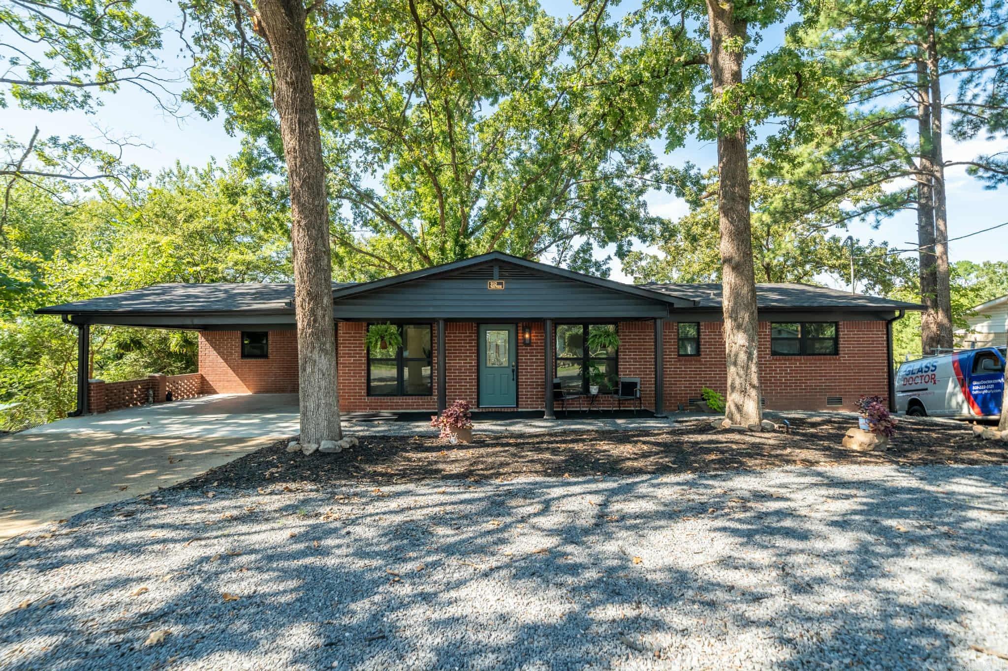 Completely updated, this 4-bedroom and bonus room, 2.5-bathroom two-story home features a cozy covered front porch. The property boasts an open floor plan, a brand-new luxury kitchen, luxury vinyl plank flooring, crisp white walls, and updated bathrooms and closets throughout. You'll love spending time outdoors on the expansive decks and living spaces, where you can take in the breathtaking views. The home includes a second-floor deck as well. Located on popular Twin Points Road, this property is conveniently close to Lake Hamilton, shopping, restaurants, entertainment, and all that Hot Springs has to offer!
