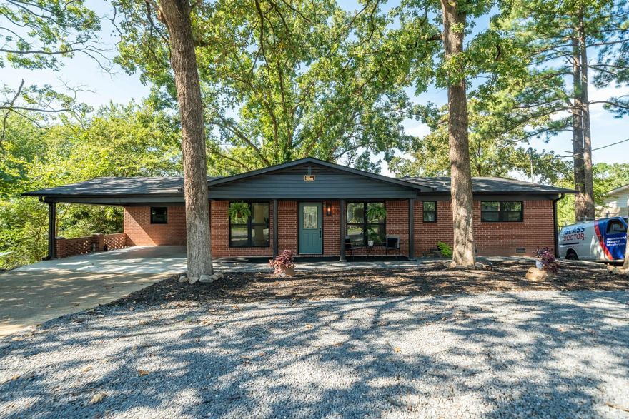 This completely updated two-story home features 4 bedrooms plus a bonus room and 2.5 bathrooms, complete with a cozy covered front porch. The property offers an open floor plan, a brand-new luxury kitchen, luxury vinyl plank flooring, fresh white walls, and updated bathrooms and closets throughout. Recent updates include a new roof, new HVAC system, sewer drain, upgraded electrical, new water heater, new concrete finish on the carport, new plumbing and fixtures, new windows, dimmed lighting throughout, new white oak flooring, new appliances, and a brand-new deck.  You'll love spending time outdoors on the expansive decks and living spaces, where you can take in the breathtaking views. The home includes a second-floor deck as well. Located on popular Twin Points Road, this property is conveniently close to Lake Hamilton, shopping, restaurants, entertainment, and all that Hot Springs has to offer!