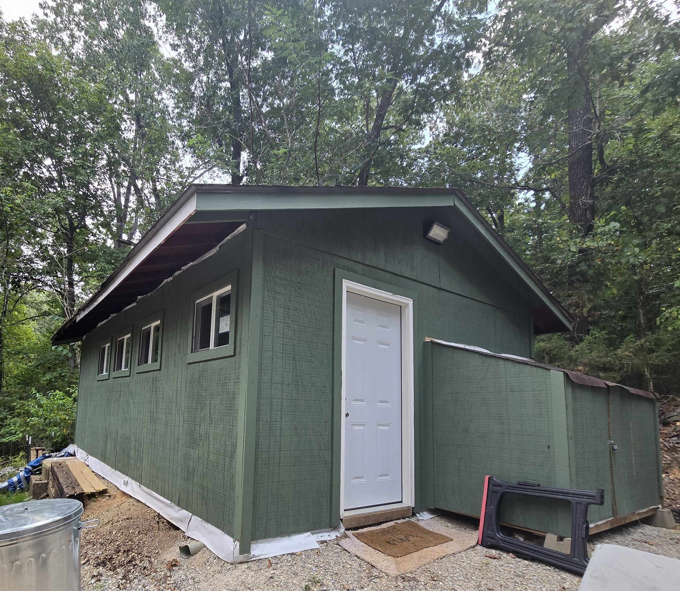 Tucked away in the peaceful Hidden Valley area of Highland, this small but functional cabin offers a rare opportunity for privacy and potential. Located on a quiet road with no nearby neighbors and minimal through traffic, itās the perfect escape for those who crave seclusion. The cabin features a living area, kitchen, and bathroom with a toilet and shower. Itās livable and in working condition, but the interior is unfinishedāgiving you the freedom to remodel to your taste or keep it simple as a rustic retreat. Heat is provided via propane heater, and cooled with a portable air conditioner. The property also includes the remains of a foundation from a previous home, adding possibilities for future building projects. With a little elbow grease, this could be a fantastic weekend getaway or full-time residence. Priced to sell as a fixer-upper/handyman special for those ready to roll up their sleeves and bring their vision to life!