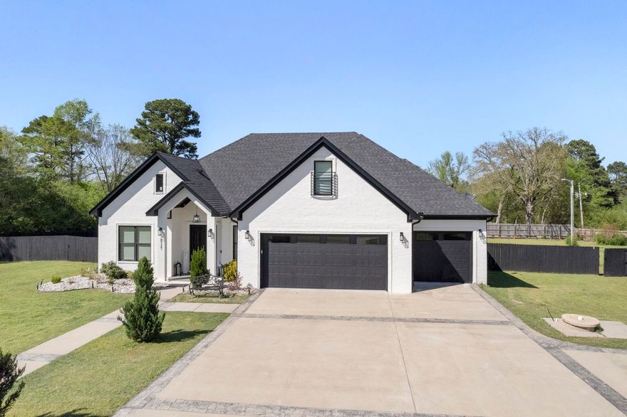 This beautifully designed custom home offers 4 spacious bedrooms, 3 full baths, a 1 half bath, perfectly blending comfort & luxury. You'll love the gourmet kitchen featuring quartz countertops & top-of-the-line commercial appliances. Rich hardwood floors flow throughout the main living spaces, complemented by soaring 8-foot doors to add a grand touch. Enjoy entertaining in the game room or relax by the outdoor fireplace in the fully fenced backyard. The dedicated office space is ideal for working from home, while the safe room provides added peace of mind. A 3-car garage offers plenty of space for vehicles & storage. This home checks every box-style, function, & location (Benton Address in Bryant School District)!