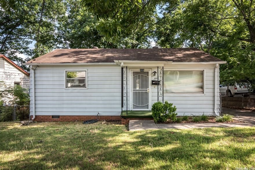 Great home w/tons of potential! The floor plan flows so smoothly & offers many options. The bedrooms, den, dining and kitchen are spacious in addition to a bonus room that could be used as an office, second living space, game room, playroom craft room, ect. Outside is a covered porch, generous parking for cars & even room for an RV! Huge outside shop w/electricity & plumbing. Updates: water heater, range, disposal, countertops, backsplash, vinyl flooring (besides original hardwoods)- 2021. SEE REMARKS!