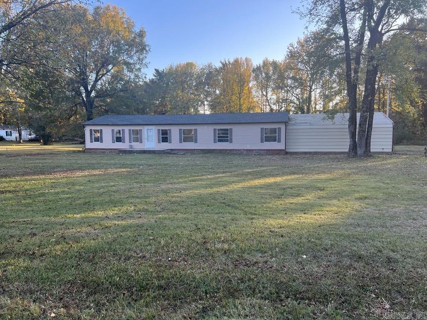Beautiful Completely remodeled!! Looks Brand New, because practically everything is new! Close to lake Conway : SINGLE FAMILY RESIDENT !!!  NOTE: Was registered a Mobile Home, but ALL paperwork has been approved as a Single family residence (Structural Engineering Certification stating is anchored/attached to Concrete Foundation to Code"; and was conveyed with a DEED as a House when purchased).  built in 2023. Beautiful Completely Spacious: 2,112 SQ. FT. Home with elegant fixtures, new flooring all over, Corner lot, freshly painted,  Wooden Storage, Nice deck, NEW ROOF, 3 bedrooms, and potential to expand to extra room,  gas Fireplace, Huge Living and dining room, BIG Laundry Room. ALL APPLIANCES INCLUDED: Washer, Dryer, Refrigerator!!! Elegant and spacious master suite, Spacious kitchen with granite counter tops. 30'x24' Metal Carport on concrete foundation (FITS 2 FUL SIZE TRUCKS) , A lot for the money! NEW ROOF (JULY 2023) light post on backyard. Seller has not lived on property, therefore there is not SRPDr. See agent remarks