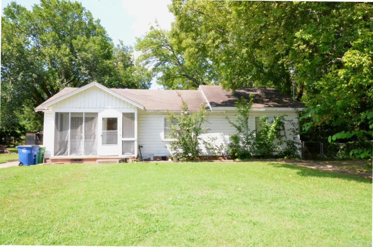 Check out this charming home in a well-established North Little Rock neighborhood on large, shaded lot. This well-loved 3-bedroom, 2-bath home has been owned by the same family since it was built in 1952. The traditional-style home blends vintage charm with thoughtful updates. Inside, you will find the original hardwood floors, solid wooden doors, and detailed trim that showcase the craftsmanship of a bygone era. The remodeled kitchen features updated cabinetry, a gas cook stove, a built-in dishwasher, and a separate laundry room. Out back, enjoy a spacious, tree-shaded yard thatās perfect for gatherings, gardening, or quiet afternoons. The 0.38-acre lot offers plenty of room to play, plus a single-car garage/workshop ideal for hobbies or extra storage.