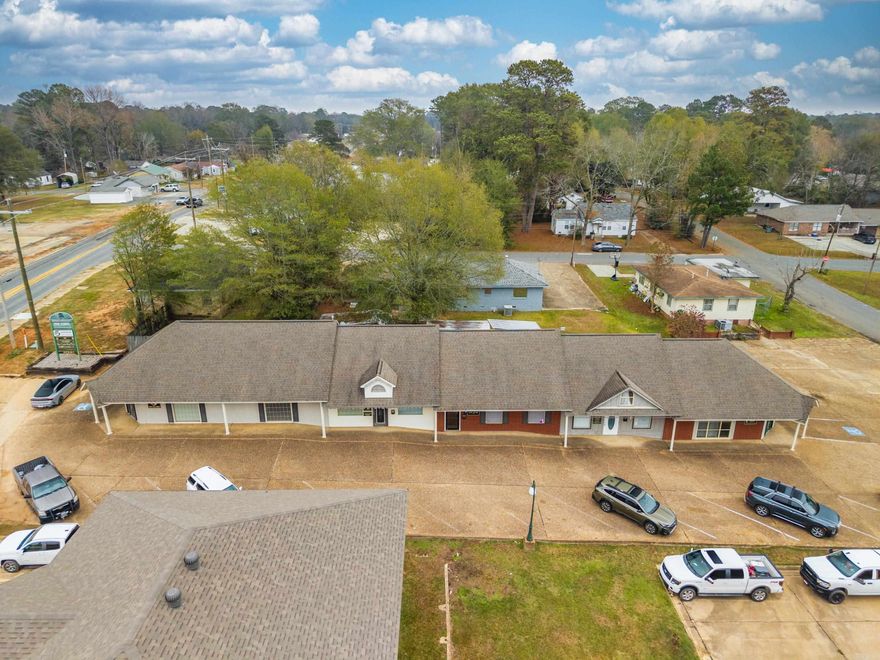 Premier Commercial Investment with Built-In Cash Flow! Unlock an exceptional opportunity in the heart of Arkadelphia with this expansive 4,764 sq ft commercial office building, strategically positioned on Pine Street in a high-visibility, high-traffic corridor. This well-maintained property offers a smart, income-producing layout featuring 5 independent office suites and 7 long-term tenants, making it an ideal choice for investors or business owners seeking immediate returns and future growth potential. Designed to accommodate a variety of professional uses, the building provides flexible floor plans, generous office space, and a welcoming professional environment—perfect for medical, legal, financial, administrative, or service-based businesses. Whether you're expanding your portfolio or searching for a headquarters with supplemental rental income, this property offers stability, versatility, and value. Now is the time to secure a commercial asset that delivers both strong occupancy and prime location appeal. Position your business—or your investment portfolio—at 2503 Pine St. and capitalize on Arkadelphia’s ongoing commercial growth.