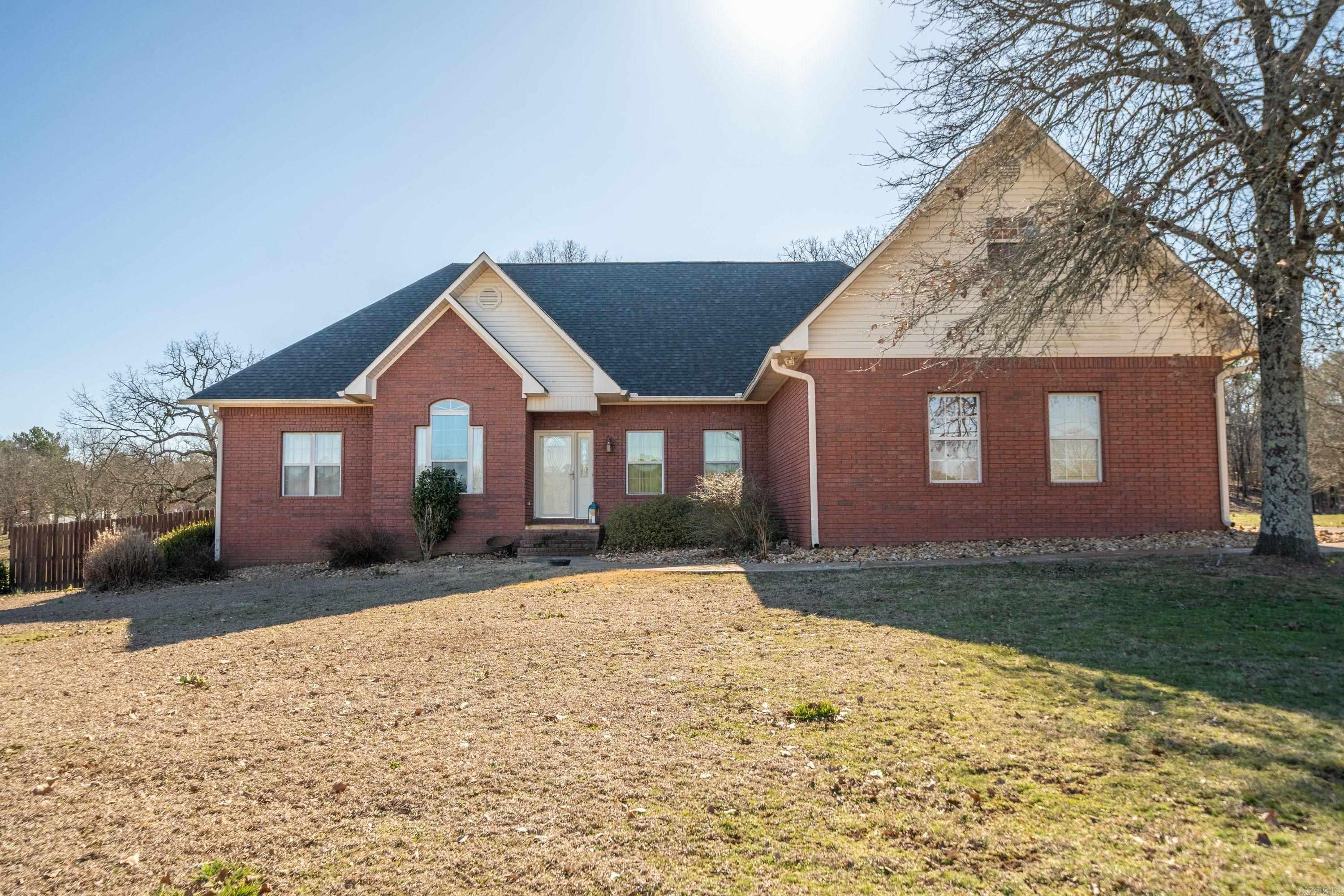 Beautiful home sitting on 3.36 acres, three bedroom, two and half baths, tall ceilings, split floor concept, formal living room, nice kitchen with granite counter tops, stainless appliances, double oven, separate dining, breakfast nook, breakfast bar, large laundry area, hardwood flooring, upstairs bonus room for storage or game room, two car garage, covered patio with hot tub, nice deck for entertaining around the beautiful sparkling in ground pool, fire pit area for enjoying your coffee while watching nature and relaxing, two storage buildings, fenced back yard for your pets, new roof 2024, new geothermal heat/air 2020, city water, all electric. Lake Hamilton Schools.
