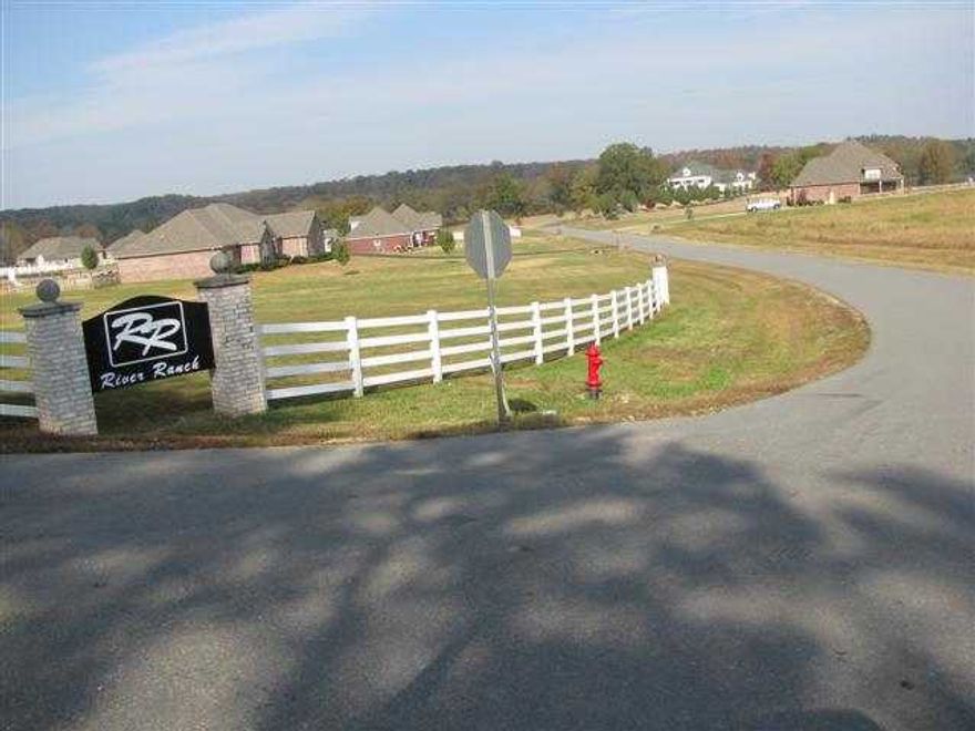 This is the perfect location for your new home! Over 22 acres in a beautiful subdivision that has over 500' of river frontage,which backs up to Quapaw.Great swimming hole, room for horses if you like! 2000 Sq.ft. min. & Bill of Ass.  Taxes are est