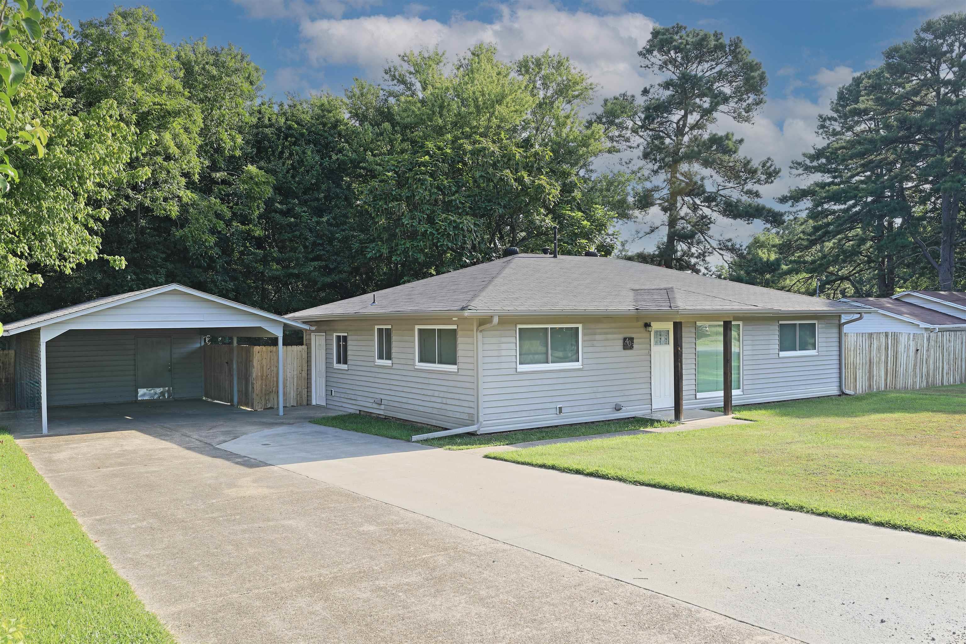 Looking for an updated, move in ready home in White Hall? Here it is! This spacious home features 2 bedrooms - with the option of a 3rd! Two large living rooms offer a great amount of room for all your needs. The second living room (sunroom) is oversized, and could easily serve as a 3rd bedroom. Beautiful new tongue and grove ceiling. Dedicated laundry room. Outside storage available in the oversized carport, and a fully fenced backyard. Newer roof, newer windows and a new water heater offer peace of mind for any buyer. Rural development eligible for potential $0 down! Call today to schedule your appointment to see this one.