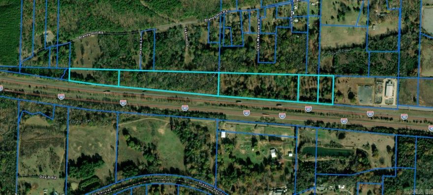 +/- 21.9 acres fronting I-40, 35,000 cars daily (Per ARDOT), borders commercial property in industrial park. Easement for Muskogee Rd to continue to and through property.  Can subdivide, $85,000/acre. Property is just outside Conway city limits, no longer subject to territorial jurisdiction.