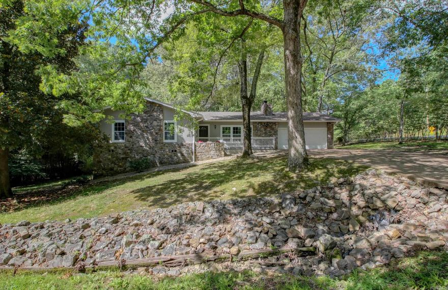 Wow! You have to come see this beautifully updated 4 bed 3 bath home on the West side of Hot Springs Village. Brand new HVAC, Flooring throughout, Granite Counters throughout, custom cabinets and closet shelving, finished basement, interior and exterior paint, and Garage door opener. Enjoy the wooded green space out on the back patio or from the comfort of the climate controlled sitting room. Three rooms on main level including master en suite. One room with en suite whole bathroom and living area in the basement with WALK-OUT access in back WITH PARKING! Could be great rental income. 2 minutes from the West Gate and 20 minutes to Bath House Row. MAKE US AN OFFER!! Happy to negotiate!