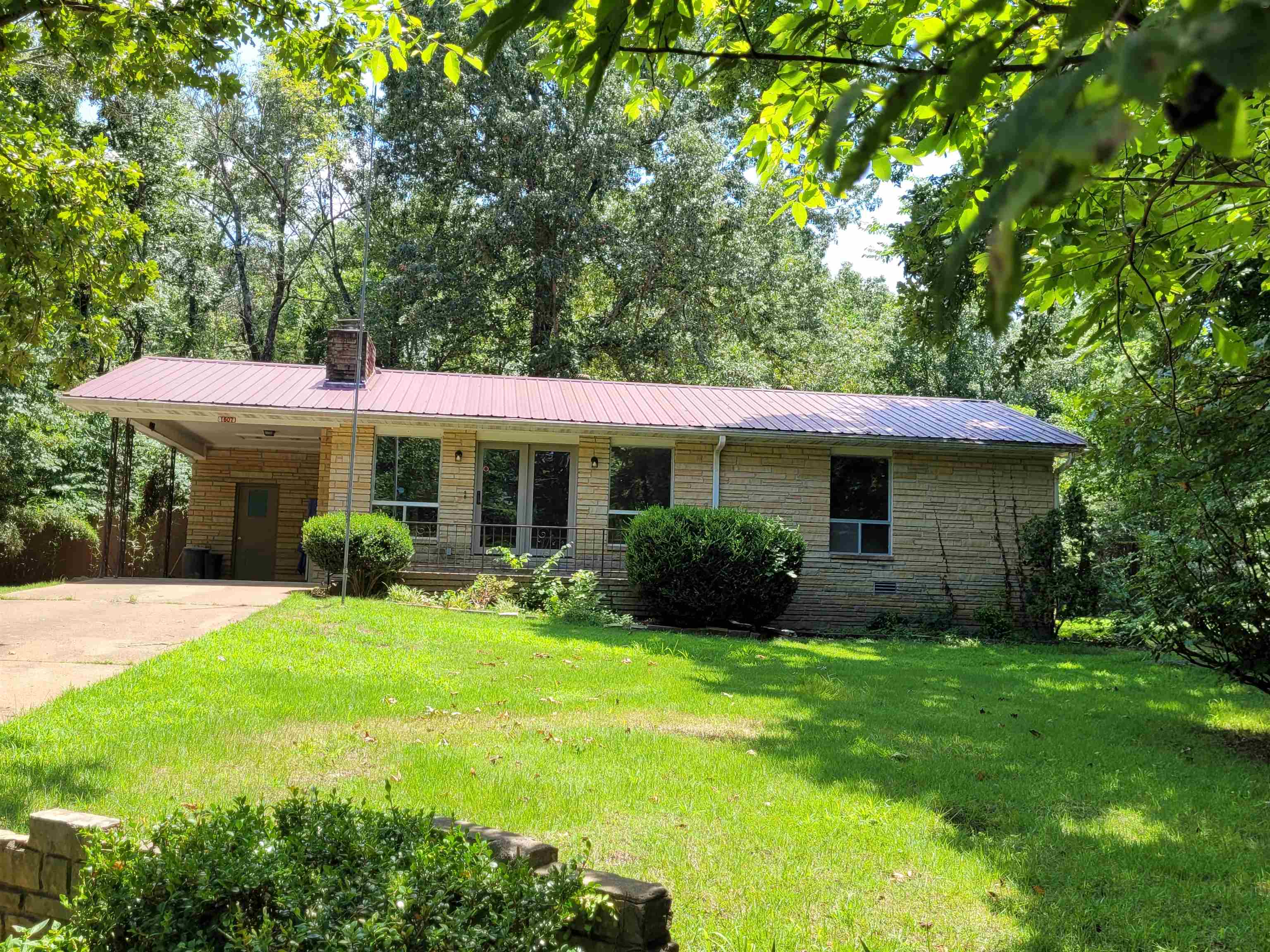 Check out this newly remodeled home in North Central Arkansas! This 2 bedroom home has over 1,100 square feet and sits on one lot. With a metal roof and brick exterior, the home is low maintenance. There is a large living room with a fireplace and lots of windows to enjoy the views. From the kitchen, you step down into an airy dining room as well as a bonus room. The bathroom includes a tub and stand up shower. The home has lots of storage and includes a storage room off the covered carport. There is also a partial basement with an exterior entrance. The one lot is surrounded by woods, have a shed and a chain link fenced area for pets. The property has a very country feel but minutes to amenities, including several lakes. Come take a look soon!