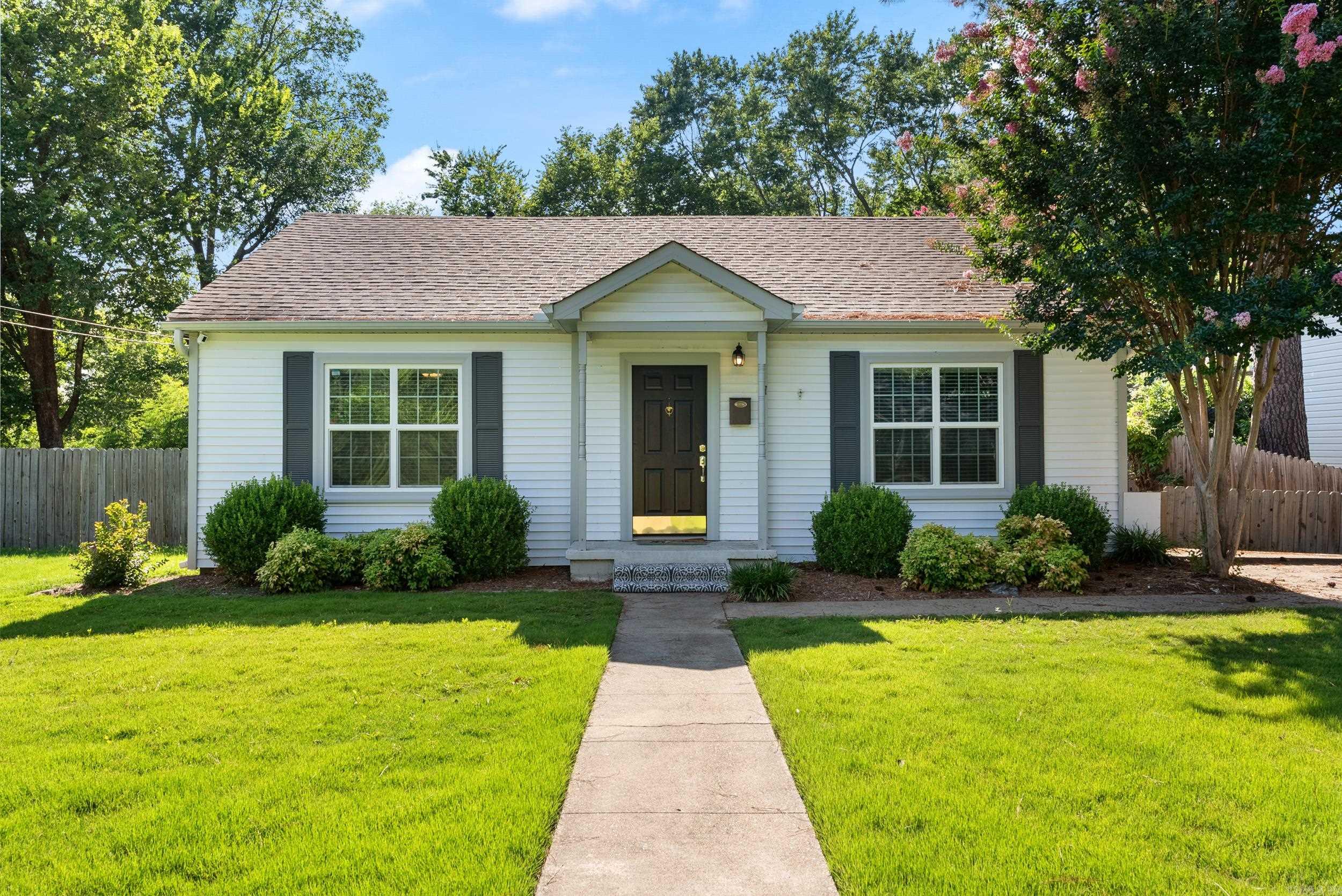 Welcome to this Old Town Conway dollhouse in a coveted location being just walking distance to UCA and CBC colleges. This home was tastefully remodeled around 2010. Custom finishes modernize the home while preserving the historic charm. Both bedrooms have generous closets for this time period of home. The backyard has a beautiful patio area with an oversized pergola and detached 2 car garage with tons of storage. Don't miss this one!