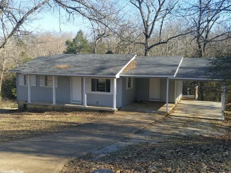 REDUCED! CUTE HOUSE!! Deck off dining area over looking wooded back yard. 2 Bedroom 1 and a half bath with carpet in bedrooms and laminate in the kitchen/dining room/living room. Storage in partial basement, and washer and dryer hook ups. All electric home with new windows. Includes fridge, stove & dishwasher, updated throughout. 2 car carport. Current renter pays $400/mo.; great return on investment--or make it your own.  Can be purchased with 7 other homes for an investor package, $299,000 MLS #15004438