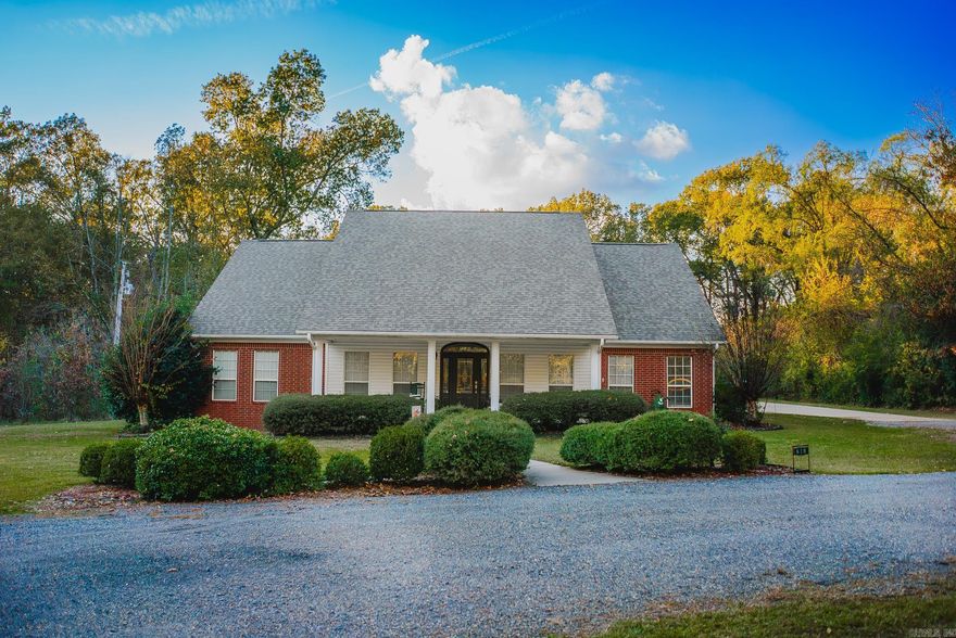 Private 2.95-acre in-town retreat, just minutes from schools, the hospital, and all the town has to offer! This property features a spacious main home with gorgeous wood floors, a granite-countertop kitchen, and a versatile layout: main level includes a primary bedroom and bath, a second bedroom with hall bath, and an office (or additional bedroom). Upstairs offers a full bedroom and bath plus a bonus room - perfect for a media space, playroom, or home gym. The backyard is a true highlight, with a spacious back porch and attached patio overlooking a tree-lined, private setting. Just steps away, a 913 sq. ft. guest house/man cave provides a bedroom, full bath, full kitchen, den, and laundry - ideal for guests, extended family, or a private workspace. Recent upgrades include a new roof on both homes (April 2025), tankless water heater, and generator wiring for both homes. With a circle drive and abundant outdoor space, this property combines privacy, versatility, and convenience in one exceptional package.