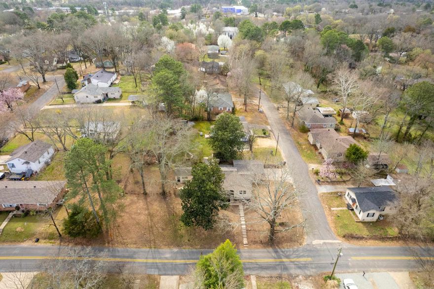 TOTALLY REMODELED home centrally located, near downtown and convenient to everything. This 3 bedroom, 2 bath, home with 1,558 square feet was gutted down to the studs in 2023 and completed February, 2024. New wiring, new ductwork, new roof, all new lighting and plumbing fixtures, luxury vinyl flooring throughout, quartz countertops, custom kitchen cabinets, updated plumbing, all new stainless steel appliances including stove/range (electric), microwave, vent hood and dishwasher, tankless gas water heater, 2 car carport, outside storage building, custom tile surround in both bathrooms.