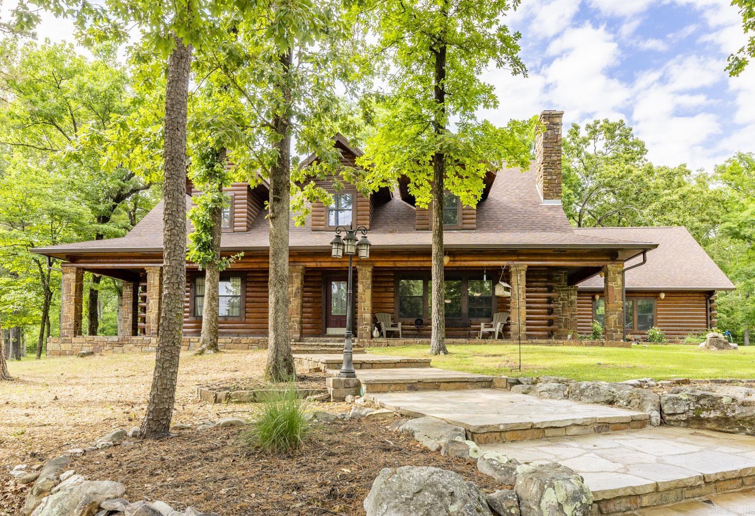 North Shores Marina and Cedar Park of Lake Ouachita minutes away! Lake access! Custom log home. 3 bedrooms, 2 1/2 baths. Two wells, three septic systems, Five acres. All concrete. New pump and pressure tank. House was all resealed, and stained. All doors and garage doors repainted. New weather stripping, new seals, new weather stripping around all outside doors and windows outside. All stone floors down stairs. New roof, gutters. All new appliances, hammered copper sinks throughout house. New back porch with tongue and groove ceiling, all new toilets, Wine cooler, utility sink. Large master bedroom, downstairs with gas fireplace, master bath remodeled, large master closet. Large pantry, large laundry area, with granite counter and lots of storage. Half bath downstairs. Large two car garage. Large lower patio. hooks for camper or RV, w/ water and electricity. New landscaping, Perennials: roses, hydrangea elephant ears, coneflowers, lavender rosemary, Japanese maple, pine and cedar trees, stocked pond, out building and shed. Chicken coup or horse barn. Two side back up to National Forest, with possibly 25 acres to lease