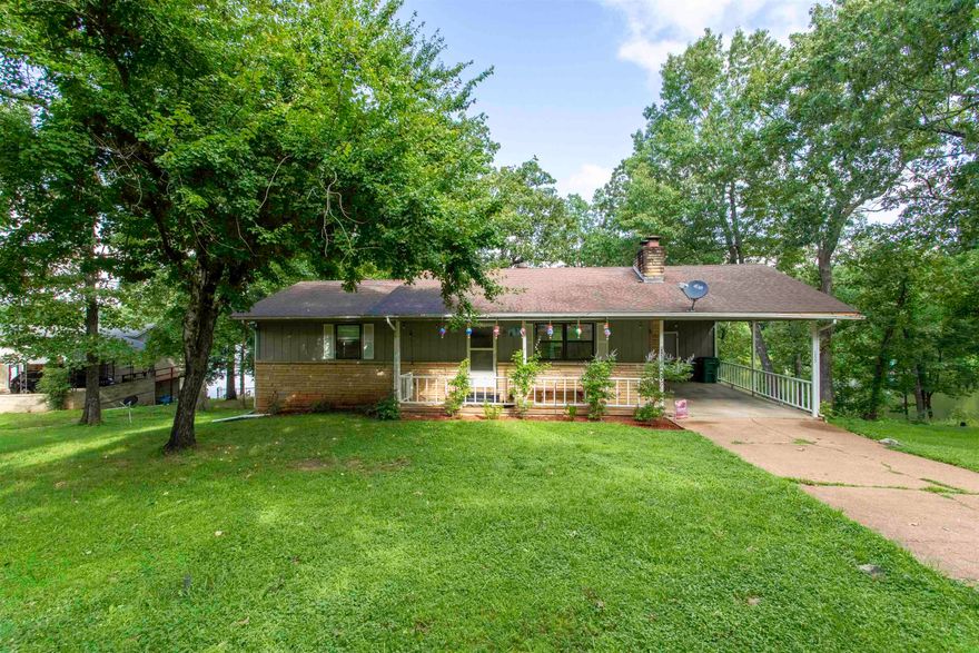 Lakefront retreat on Pioneer Lake in Horseshoe Bend, AR!   Discover Lakeside living at its finest in this peaceful neighborhood tucked away in the Ozark foothills in Izard county. Close to amenities but away from the hustle and bustle of metropolitan life.  This recently renovated home offers 162 ft of shoreline with concrete steps for easy lake access. Enjoy kayaking, canoeing, swimming, or fishing on this no-wake lake. The main level features 1,144 sq ft, 2 bedrooms, 2 baths, a cozy sunroom with stunning lake views, ideal for year-round enjoyment, and a cozy wood-burning fireplace. The lower level 563 sq ft, includes a spacious bonus room used as extra living space and workout area, a recently added 3-person sauna, another full bath, and a second fireplace. Plenty of storage throughout. New septic system installed in 2020. Water heater replaced recently.   Peaceful setting perfect for full-time living, weekend getaways, or vacation rental potential.  This one won't last long contact your favorite real estate professional to set up an in person tour.
