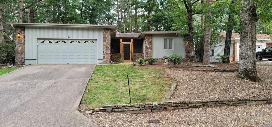 Welcome to this charming, well maintained single story home! As you walk up to the front door you'll notice a screen-in front porch. Once inside, this home offers luxury vinyl flooring throughout the house, 2 large bedrooms & updated bathrooms. The owner's suite has His & Her closet space. The open living room is equipped with a gas connection/wood burning fireplace with a fan to blow warm air for those cold nights. The large, connected Arkansas room with newer insulated, thermal pane windows helps keep the room comfortable while allowing lots of natural lights in. An eat in kitchen with built-ins, granite counter tops, pull out drawers and ample cabinets for storage. The utility room has more storage and a built-in desk. The oversized 2 car garage has additional floor to ceiling storage for all your tools & extra stuff & attic is partially floored for additional storage. Enjoy the large, fenced backyard space. Roof 2018. Seller currently has Home, Termite, & Pest Warranty that can be transferred to next owners. There is a one time $1500 Buy In fee for new members to be paid at closing.