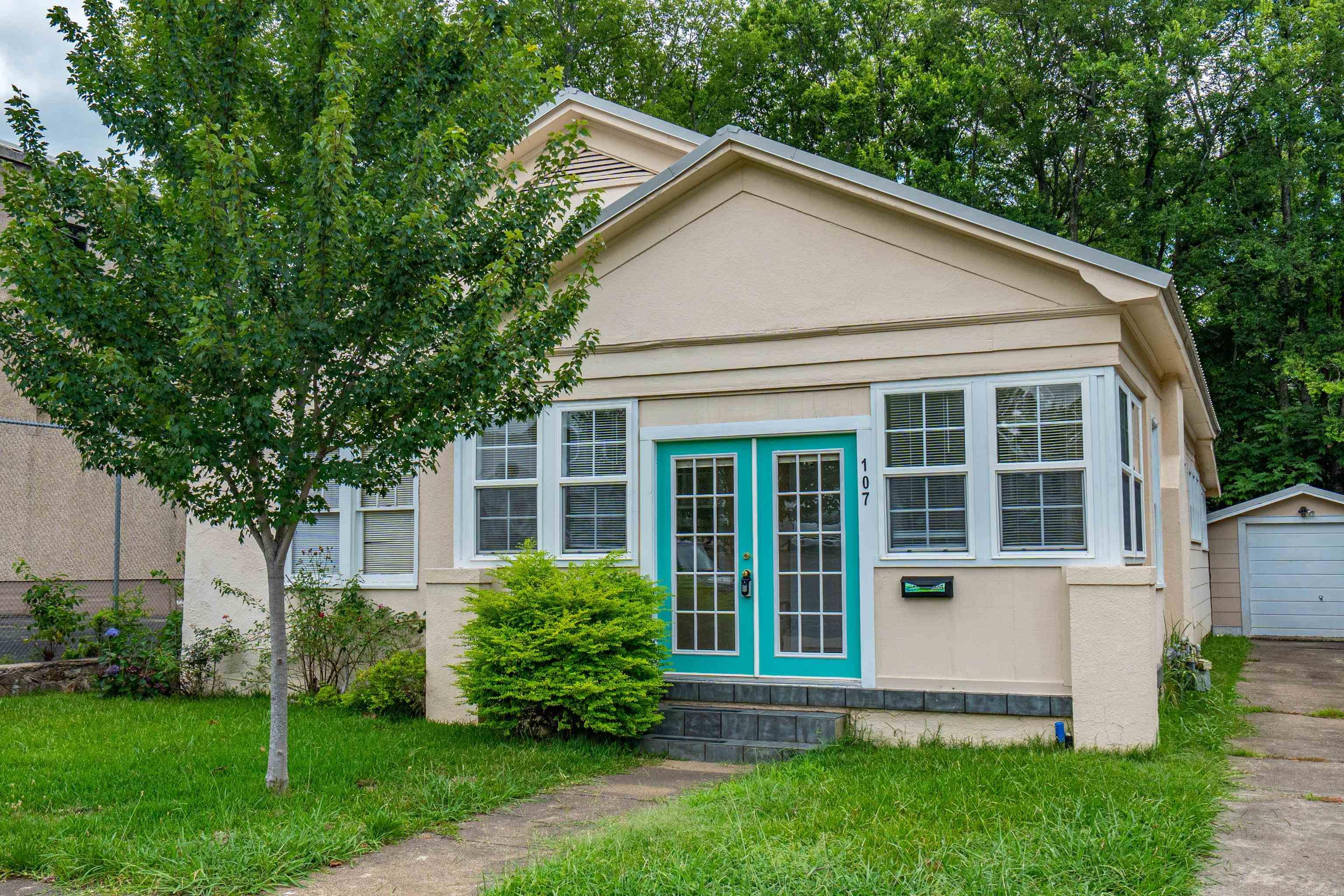 Unique opportunity in the heart of Hot Springs! This versatile property is located just steps to Downtown and minutes to Oaklawn, zoned for both residential and commercial use. With a new roof in 2019, original hardwood floors, and an expansive sunroom, this property offers endless possibilities. The interior boasts three spacious bedrooms, a stunning living room centered around a gorgeous fireplace, and plenty of charm. Schedule a showing today and explore the potential of this rare and unique property!