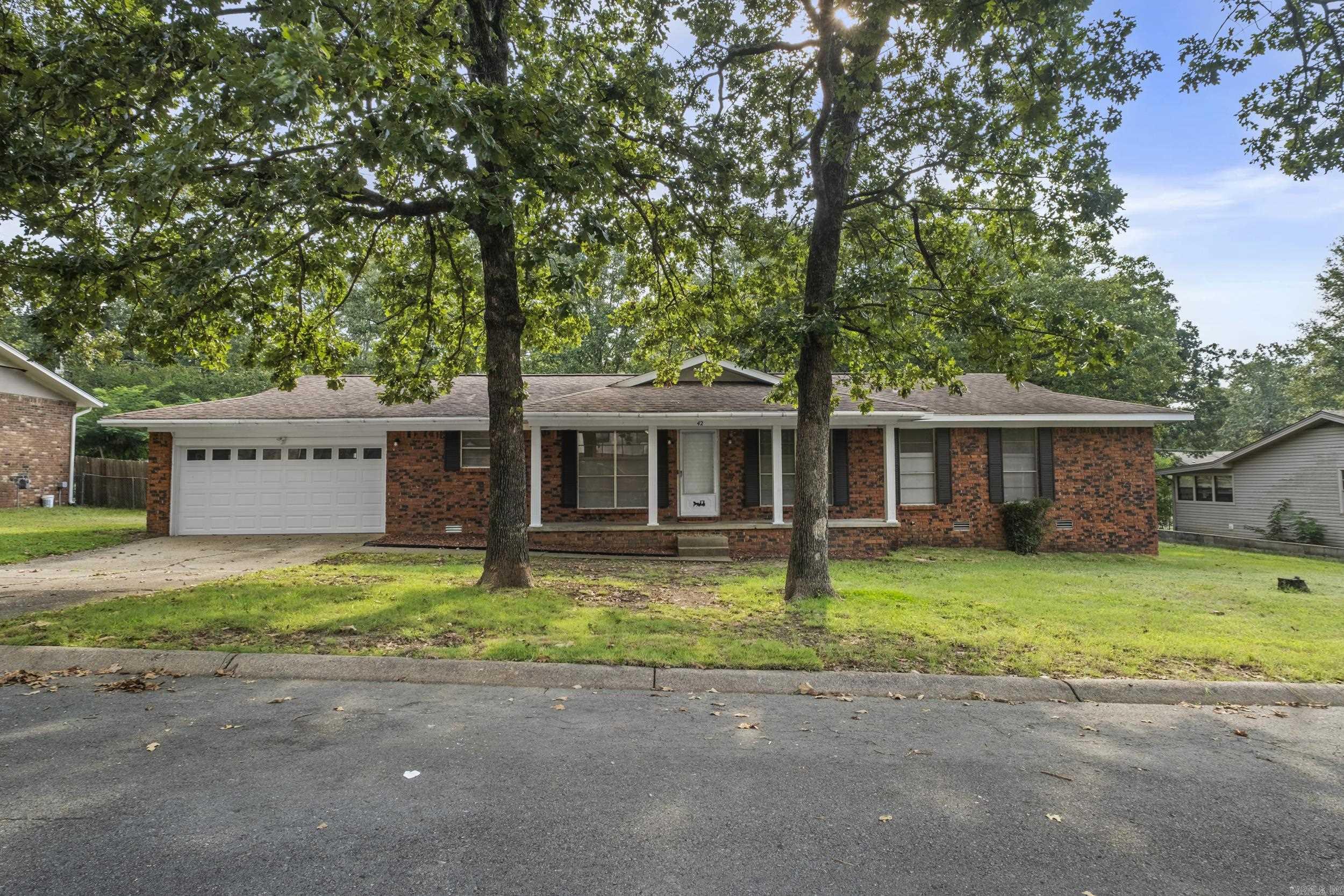Charming one-level all brick home featuring 3 bedrooms, 2 full baths and 2 car garage.. This property offers a comfortable floor plan with plenty of potential for updates to make it your own including a flex space. Whether you're looking for a starter home, downsizing option, or investment property, this home provides a solid foundation with opportunity to add your personal style. The roof was replaced in 2010, the water heater in 2018 and the AC unit in 2008. The kitchen includes a dishwasher updated in 2013, while the stove remains from 1998, ready for a new owner's touch. Home is eligible for Rural Development financing.