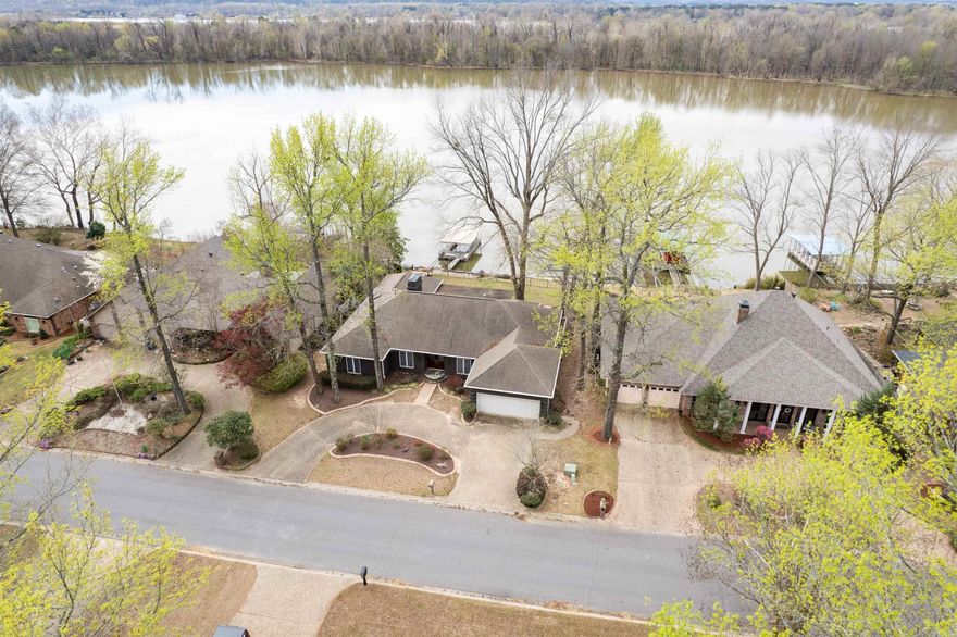 Experience riverfront living at its finest in this stunning home nestled in the heart of Maumelle, right along the Arkansas River. Wake up to breathtaking sunrises and unwind with spectacular sunsets from the expansive sunroom designed to impress. The kitchen is a true showpiece, featuring sleek granite countertops, a stainless steel built-in oven and microwave, a minibar, side-by-side refrigerator, and a dishwasher—perfect for both everyday living and entertaining. This thoughtfully designed single-level home offers four spacious bedrooms and three full bathrooms, each enhanced with stylish designer sinks and countertops. Step outside to a full-size fenced backyard that offers both space and seclusion, along with the rare luxury of your own private boat dock—ideal for enjoying life on the water. The garage includes an oversized work and storage area, while the large patio provides ample room for hosting gatherings or relaxing in the peaceful surroundings. Don’t miss the opportunity to make this exceptional property your dream home.