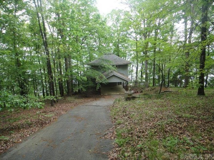 Stellar view of beautiful Greers Ferry Lake!! Contemporary house sits on 1.66 acres with views of lake on all three deck levels. 3 story with lower level being a walk-out basement. Small storage area attached to lower level. Can be 4 BRs or 3 BRs and Game Rm. Master BR is on 2nd level with almost panaramic view. Please see Agent Remarks.