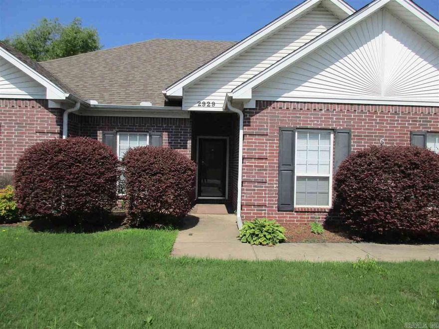 Beautiful home with stained concrete floors and a split floor plan, with a fenced in backyard.