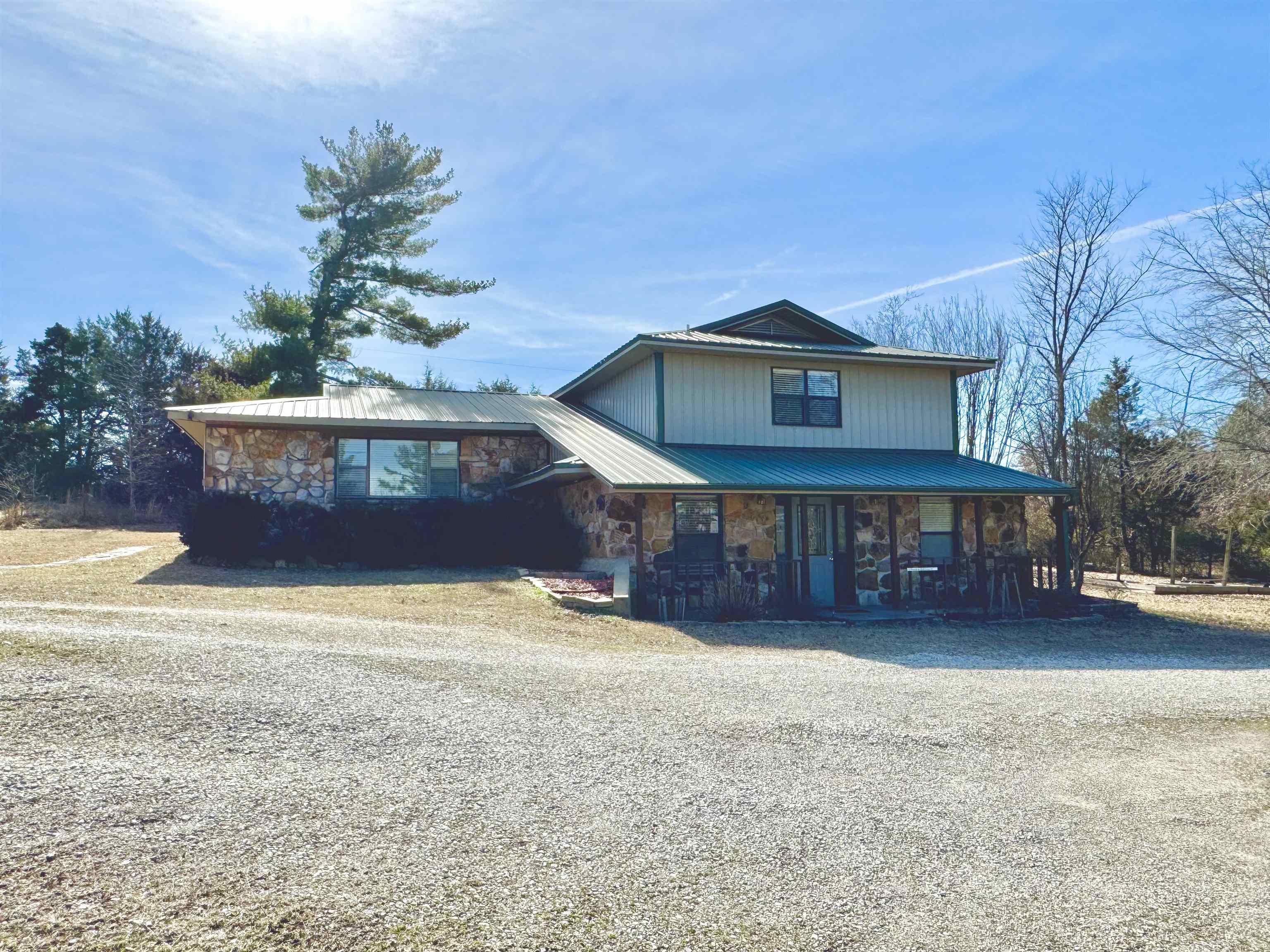 4 Bedroom, 3 bath home sitting on 2.42 manicured acres! This home features a large living area and spacious kitchen with a separate dining area. Upstairs has 3 bedrooms & 2 bathrooms, with the primary bedroom having a walk in closet. The basement has a den, 1 bedroom, 1 full bathroom, storage/mechanical room, & laundry area. The home has a private setting with a large stocked pond, 30x30 Shop, 12x28 storage building, & two carport coverings. Fantastic Location & conveniently located.