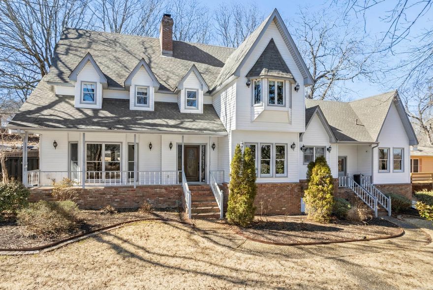 Beautifully updated home full of character and charm. This stunning home offers updates throughout, including the kitchen and bathrooms, main level HVAC, refinished hardwood floors, and modern lighting and fans. Other updates of a (2019) new roof, (2021) privacy fence, and spacious deck add peace of mind and outdoor enjoyment.  Step inside to discover authentic character - an exposed brick wall in kitchen, gorgeous wood molding, a striking 3-story fireplace chimney, and three cozy gas log fireplaces (one on each level). The home features authentic brick flooring, tall ceilings and abundant natural light.  The large primary bedroom includes its own fireplace. The separate dining room, generous eat-in kitchen and large living room offer ideal spaces for gathering. A beautiful sunroom provides a tranquil retreat.  Two private offices make working from home comfortable and efficient.  Enjoy added security with a full home security system including cameras (equipment will remain), covered front porch, a serene backyard with deck, and a lawn sprinkler system. Private alley access to the home adds an extra level of ease and exclusivity.