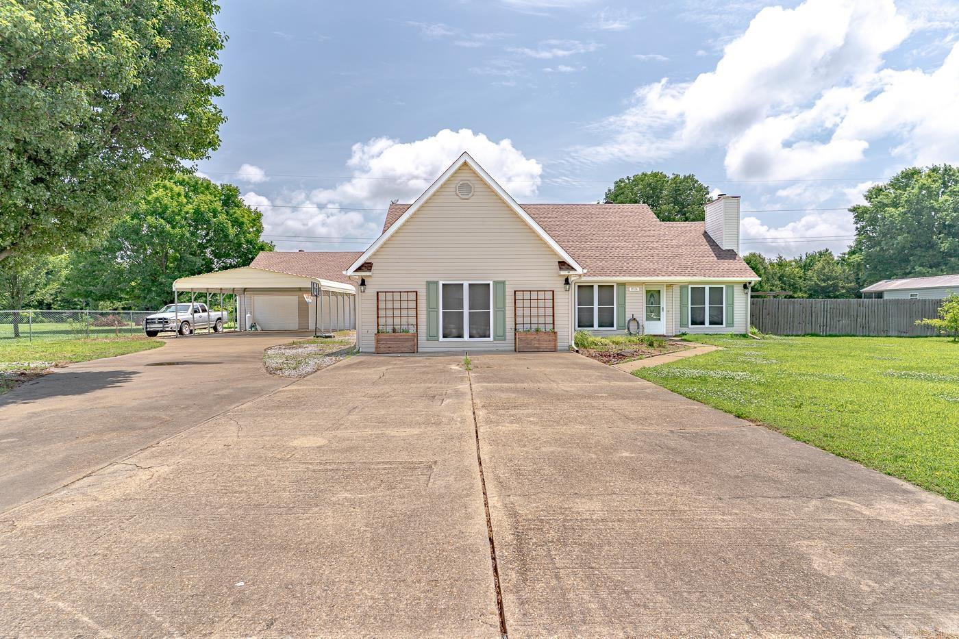 Welcome to Market: 13326 Dixie Lane of Trumann, to Poinsett County, of the Trumann Public School District. Located just outside the city limits for ultimate privacy. This is what you've been looking for. As you enter the home you'll find a large great room with fireplace, dining room, kitchen and just beyond a sun room with a wood burning stove. Turn down the hall, past the guest bathroom and one of the large bedrooms to find the primary bedroom with en-suite bathroom, large soaker tub, shower, and walk-in closet. As you continue, you'll pass the laundry room and other spare bedroom before entering the oversized living room, which could even be transformed into a fourth bedroom. Step out from the sun room into your expansive back yard, which has been separated into multiple useable areas. There's really no limit to how you could use this 1 acre lot. You'll find this fantastic property just south of Trumann proper, but still close to everything in town. The High School is only 3.5 miles away, Walmart 5.9 miles away, and I-555 is less than 1 mile away, providing you easy access to anywhere you want to go. This home checks all the boxes! Call today to schedule your private viewing.