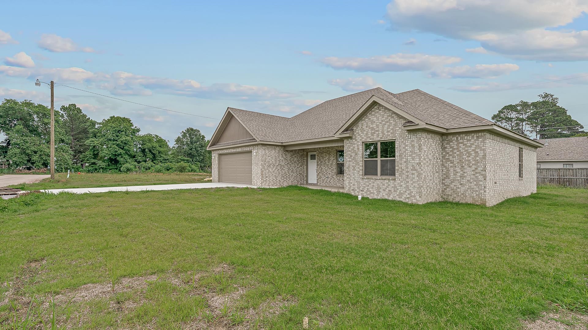 Great opportunity seven miles east of Jonesboro in the beautiful town of Lake City. This new construction is completed and ready for its new owner! This home features an open floor plan, four bedrooms two full baths, and a spacious yard for entertaining. The home also features stained and polished concrete floors, solid surface countertops, all new appliances, and led lights throughout the home. This home is a newly developed sub division. No HOA