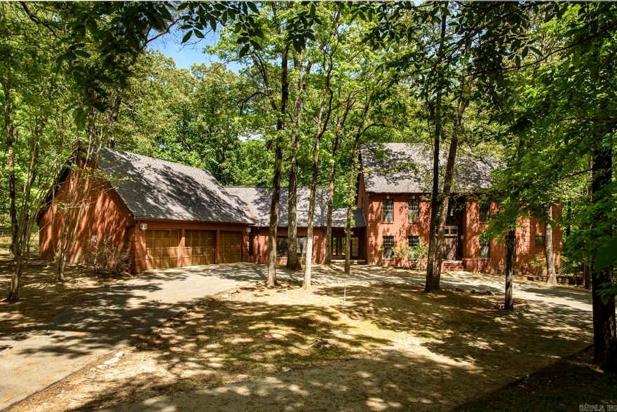 Rarely does a home of this caliber, blending architectural soul with modern utility, hit the market. Situated in a desirable school district, this estate offers a secluded country atmosphere just blocks from city conveniences. Opportunities like this are fleeting -once it’s gone, it’s gone! *The Main Event* Experience "Thorncrown Chapel" vibes with soaring ceilings, rich wood accents, windows & skylights that bathe the open floor plan in natural light. Nature surrounds the Screened-in porch, while the living area features a massive wood-burning fireplace and built-in bookshelves. The chef’s kitchen boasts new countertops, a gas range, a wall oven, and a sunny breakfast nook. **Work & Play:** Dedicated office with built-in desk plus a massive game/media room. **The "Super" Laundry:** One of two laundry areas, this space is larger than most kitchens and features a full suite of appliances and endless storage.  **The Retreat** The primary suite is a sanctuary with its own fireplace, jetted tub, and dual walk-in closets. Outside, enjoy a massive deck with built-in seating, a dog run with dual kennels, and a private outdoor shower.   **This isn't just a house; it’s a lifestyle legacy!**