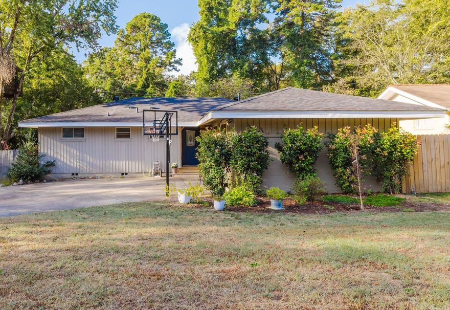 Come home to this updated Broadmoor 3BR/2BA home that boasts of 3 living spacings & extra landscaping! You will find an updated kitchen that opens to a bonus room that can serve as a den/family room. Kitchen has granite countertops, matching stainless steel appliances, breakfast bar, oversized farmhouse sink, large pantry/laundry room. Past the kitchen is another living room/dining combo. The dining space is large enough to host all your holiday gatherings! Beyond that is another bonus room that has barn doors for added privacy for an office/school room! NO carpet anywhere. Hardwoods in all living spaces with tile in wet areas. Recessed lighting, ceiling fans, plantation blinds, & custom built-ins. Hallway bathroom recently updated. Primary suite offers his/her closets along with a full bathroom. UPDATES no more than 5 yrs old: New roof, soffits, fascia. Exterior paint. New HVAC/Furnace/ductwork. New deck. New energy efficient/double pane windows. New HWT.  In the backyard you will find a shed/man cave that is cooled with electricity. Enjoy your evenings out in the thoughtfully planned backyard! Neighborhood comes with community pool/playground/lake! *AGENTS SEE REMARKS