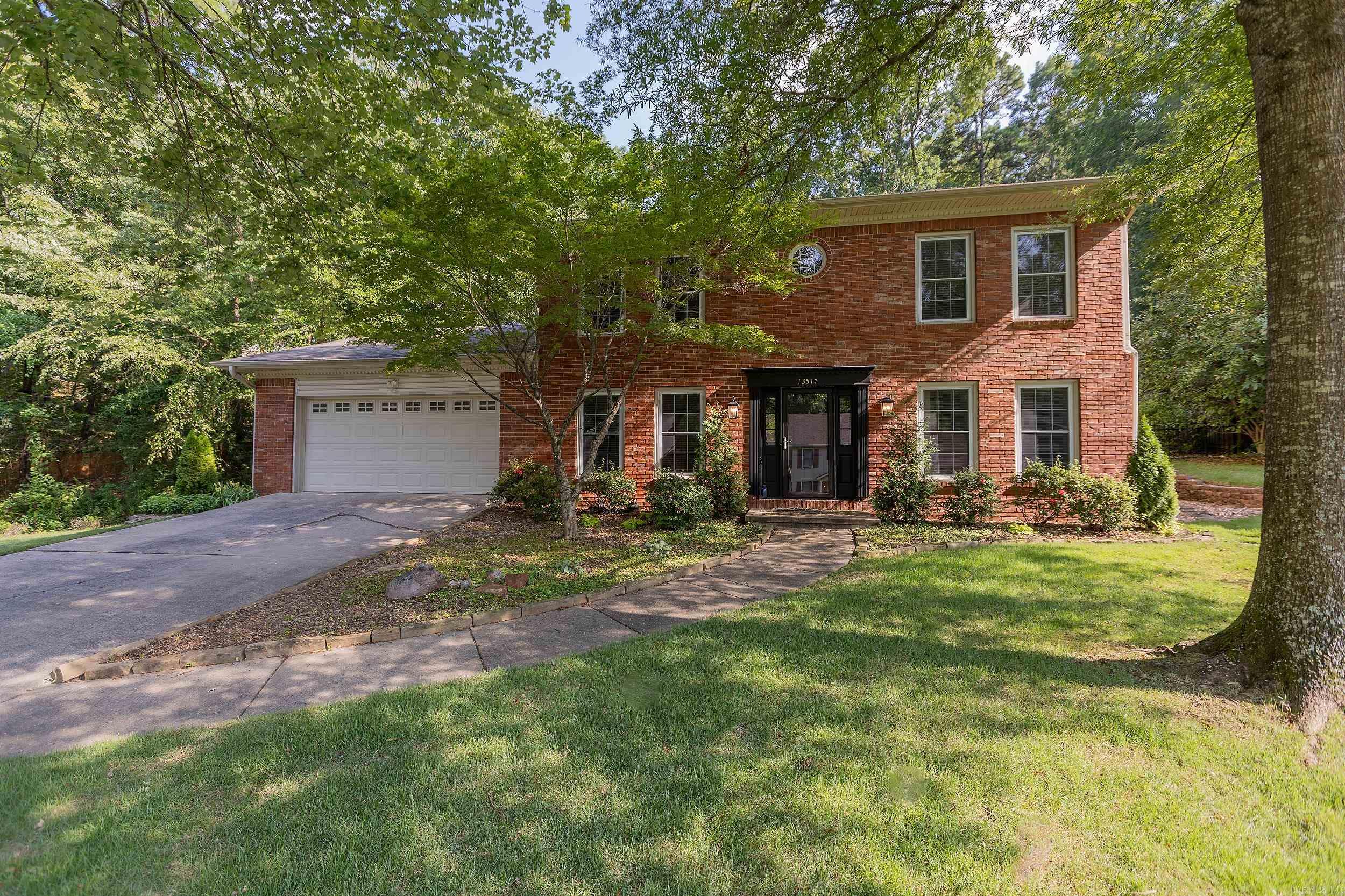 Welcome to this well cared-for 3-bedroom, 2.5-bath home offering comfort, privacy, and convenience in one perfect package. Situated with no neighbors on one side and backing up to peaceful green space, this home features a beautifully landscaped yard, complete with a tranquil pond and water feature—your own backyard retreat. Inside you'll find hardwood floors, newer carpet, and a cozy gas fireplace in the main living area. A dedicated home office provides the ideal space for remote work or study, while the heated screened-in porch offers a relaxing spot to unwind and enjoy the view in all seasons. The attached garage includes a separate workshop space, perfect for hobbies, projects, or extra storage. Located directly across from the neighborhood pool and playground, and close to local schools and shopping, this home offers an unbeatable location for families. This is a rare find that won’t last long!