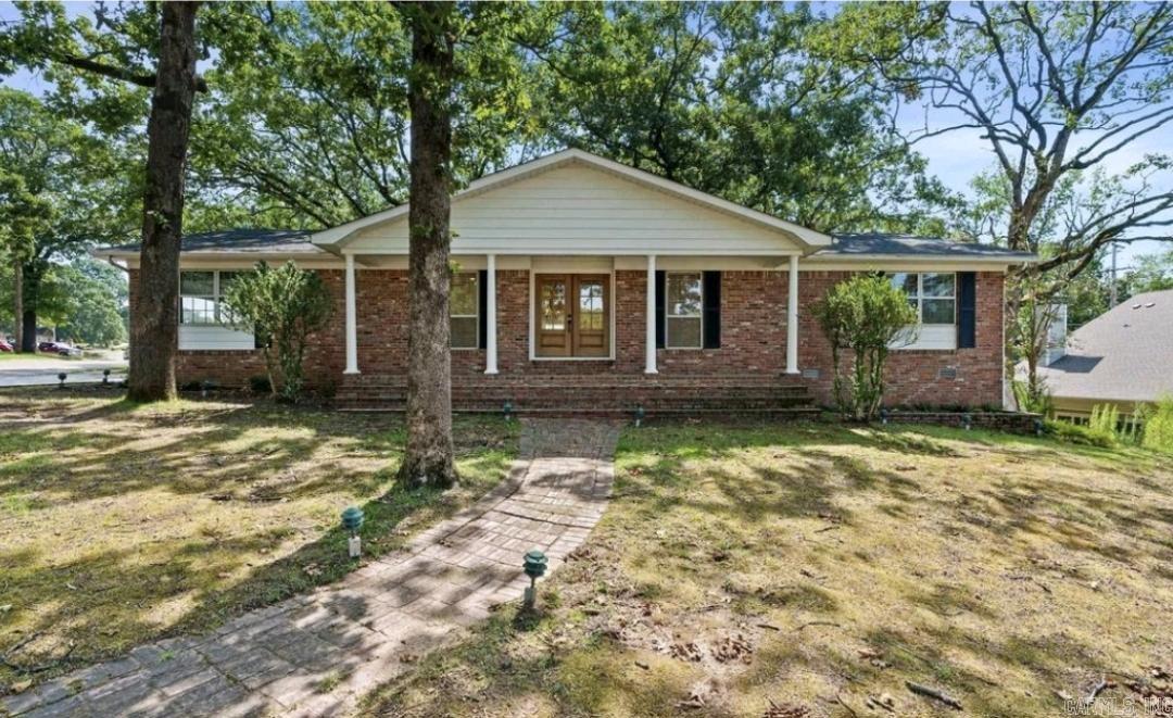 Step into newly-renovated charm with this beautifully modernized 3-bed/2-bath home on a spacious corner lot in a highly walkable neighborhood! And an added bonus - Location! This gem is only an 8-minute commute to downtown Little Rock, and mere minutes from shopping/groceries on McCain & JFK, making quick work of weekly errands! From your arrival, the rare double-door entry sets the tone for the striking interior. Inside, you'll find the sunroom of your dreams (perfect for morning coffee!), and a thoughtful blend of elegance in high-end marble tile & hardwoods! An entirely new kitchen features brand-new appliances – including a double oven with built-in air fryer that makes entertaining easy! New bathrooms offer gorgeous finishes, and oversized windows throughout the home bring abundant light. A brand-new garage adds abundant storage, and a new security system brings peace of mind. This large one-story checks all your boxes - elite modern updates & a location that conveniently combines both work/play in downtown Little Rock, with the peaceful ease of suburban life. This perfectly-located, spacious, entirely-renovated dream home is awaiting you!
