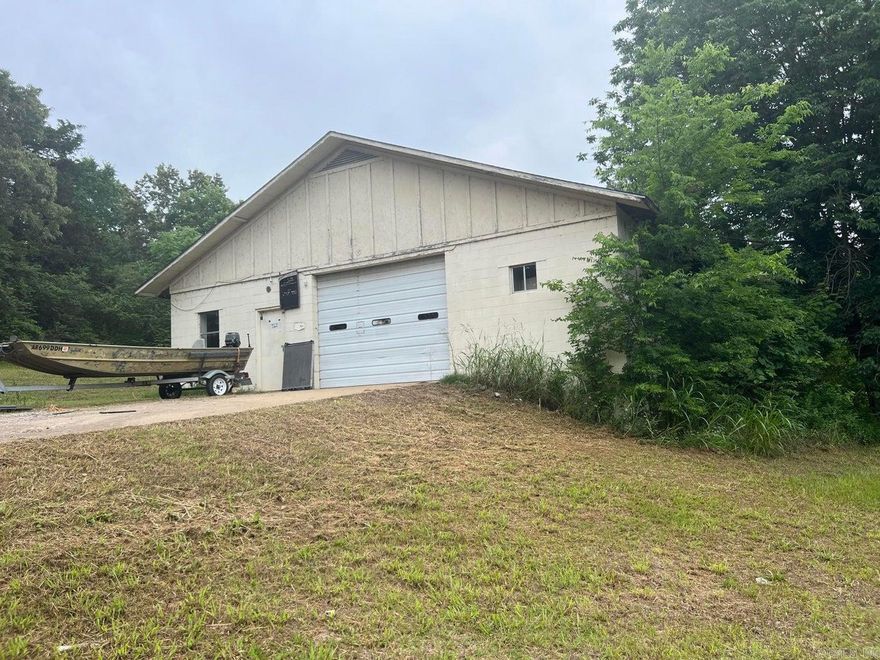 Location, Location, Location!! 40x90 Shop on 3+/- acres just minutes from town! Shop features roll up doors, walkthrough doors, office space, and bathrooms. Shop was previously a lawnmower repair shop. Wood Stove in Shop does not convey.