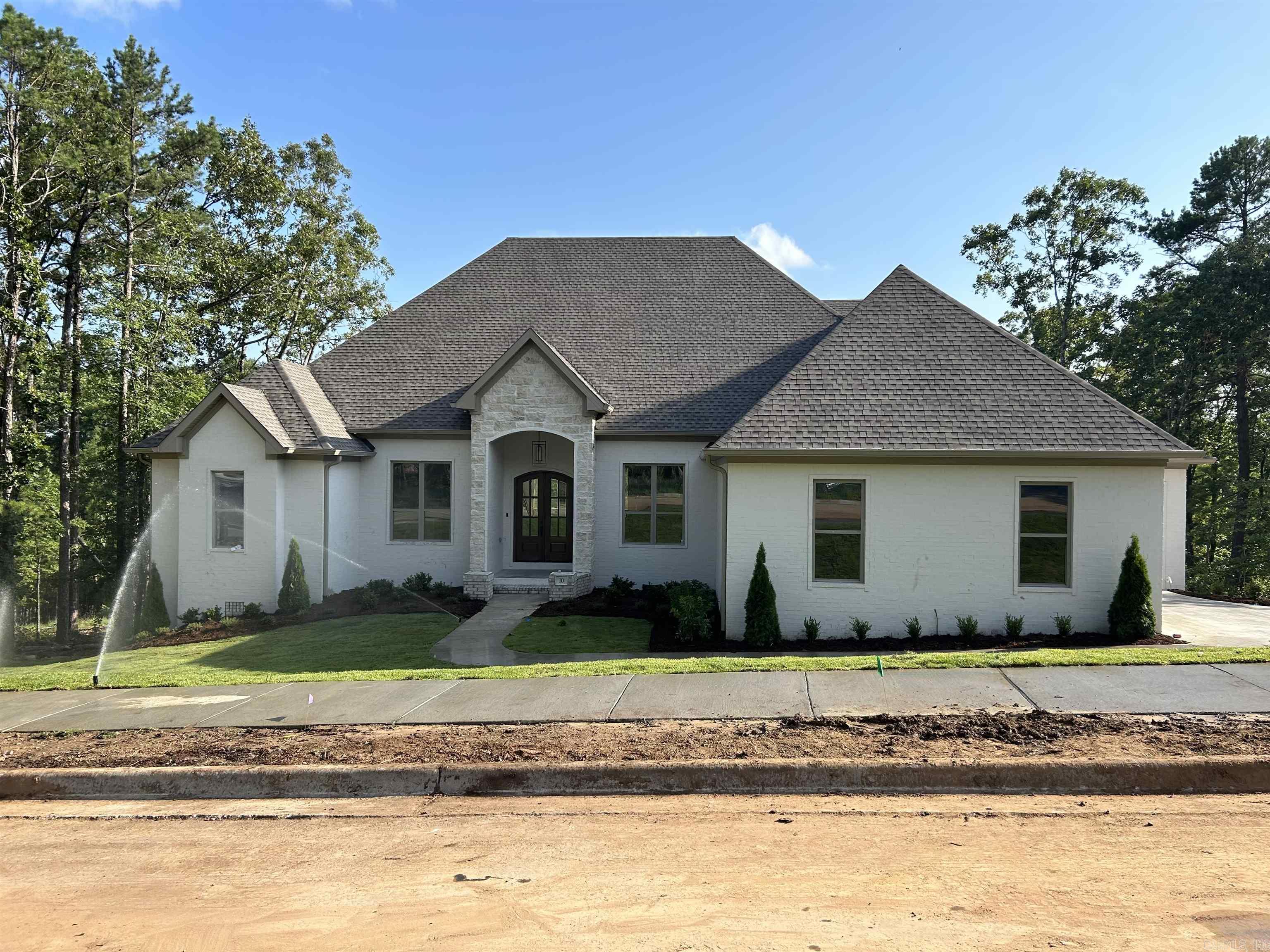 New Construction located on a greenbelt lot in BEAR DEN, one of Little Rock newest high-end neighborhoods. You enter this brick and stone home through double French doors. This home lives like a one level home with the oversized great room, formal dining, kitchen, informal dining area, private study and three bedrooms suites all on the main floor. Upstairs features another bedroom suite or playroom. The oversized, covered, deck overlooks the large backyard and features a fireplace. Additional features include a three-car garage. This home is being built by Hartness Construction, who have been building in Central Arkansas for over 50 years.