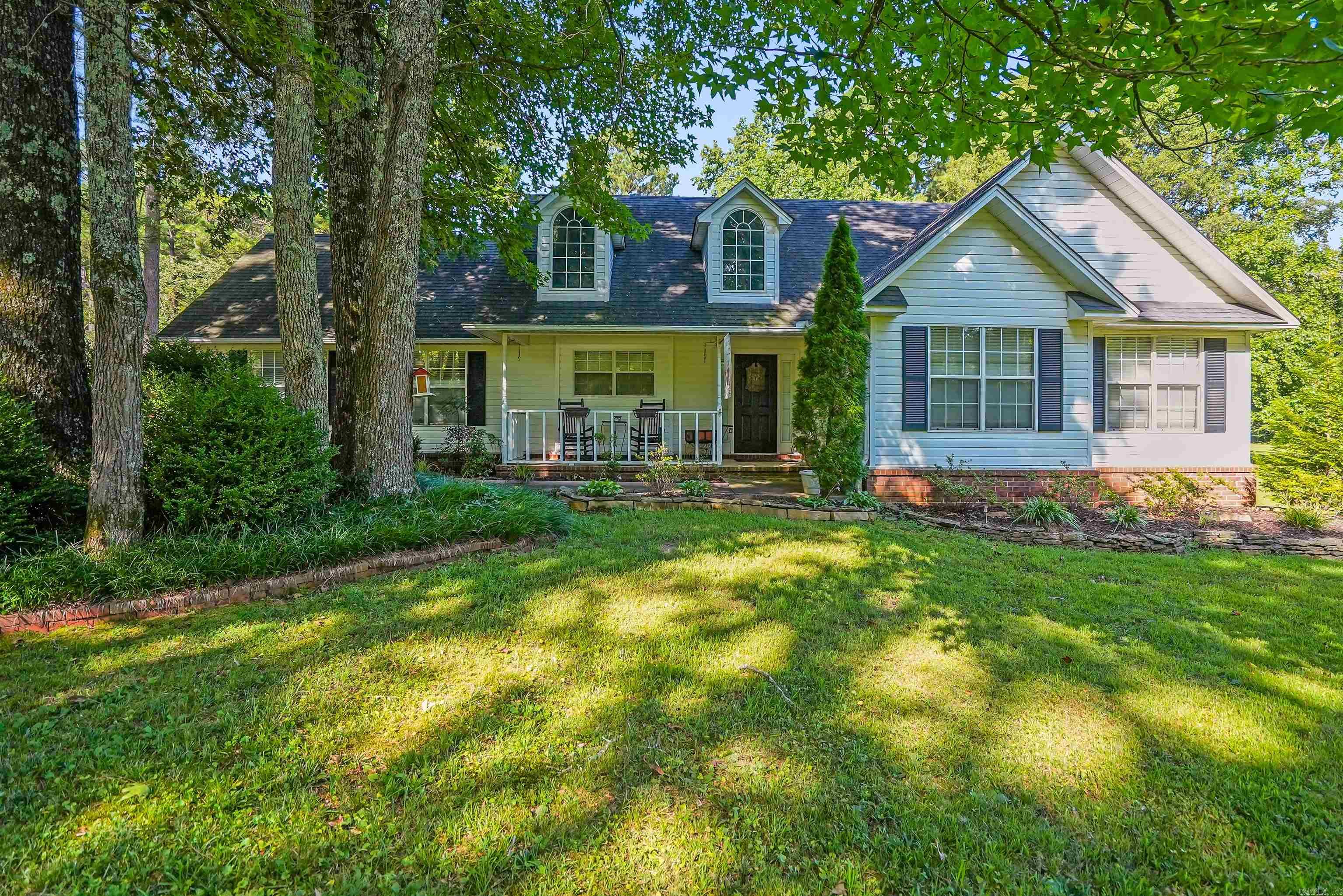 Welcome to this spacious 3-bedroom, 2-bathroom home nestled on a picturesque 2.58-acre corner lot. With 1,896 sq ft of well-designed living space, this property features an open-concept layout, vaulted ceilings in the living room and master bedroom, and a split floor plan that offers privacy and comfort. The master suite is thoughtfully separated from the additional bedrooms and boasts soaring ceilings and serene views. The living area flows seamlessly into the kitchen, dining space and great room, creating an ideal setting for entertaining or relaxing. Step outside to your private backyard retreatācomplete with lush landscaping, a peaceful koi pond, and a charming gazebo perfect for morning coffee or evening gatherings. Mature trees in the front yard offer shade and curb appeal, adding to the property's inviting charm. Donāt miss this rare opportunity to own a home that combines space, privacy, and natural beautyāschedule your showing today! Refrigerator to convey. Seller offering $10,000 allowance towards buyers choosing. *Agents see remarks*