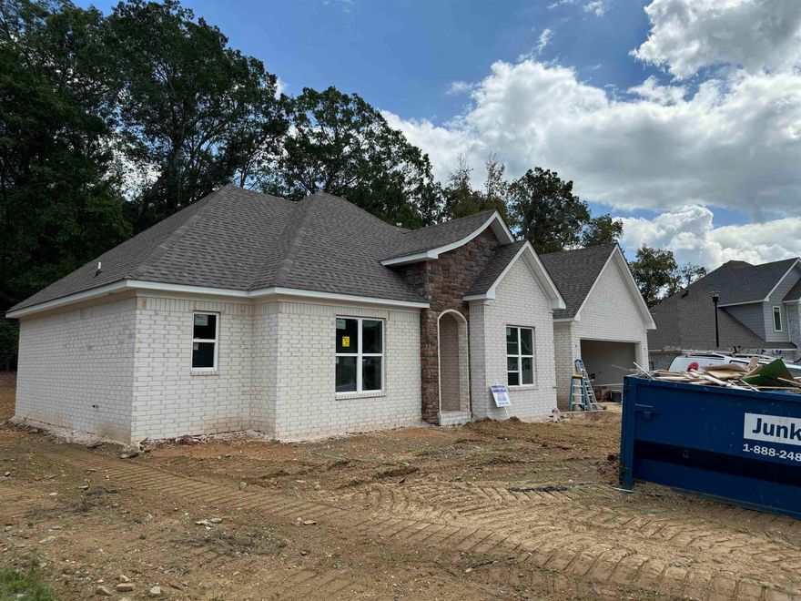 Picture Perfect New Construction Home in the Beautiful Roman Heights Subdivision. Amenities include: Approximately 1910 SF, 3 Bedrooms, 2 Bathrooms, Office/Study,  Living / Dining Combo, Kitchen / Dining Combo, Kitchen Island with Breakfast Bar, Split Bedroom Floorplan, Open Floorplan, Living Room with Gas Log Fireplace, Laundry Room, Pantry, Nice Size Primary Bedroom, Primary Bathroom has Soaking Tub with Separate Tile Shower, Large Primary Closet, Brick and Rock Exterior, Covered Rear Patio with wood burning fireplace, Covered Front Porch, 2 Car Garage, Nice Cul-de-sac Lot, Bryant Schools, and Much More... A Must See.....